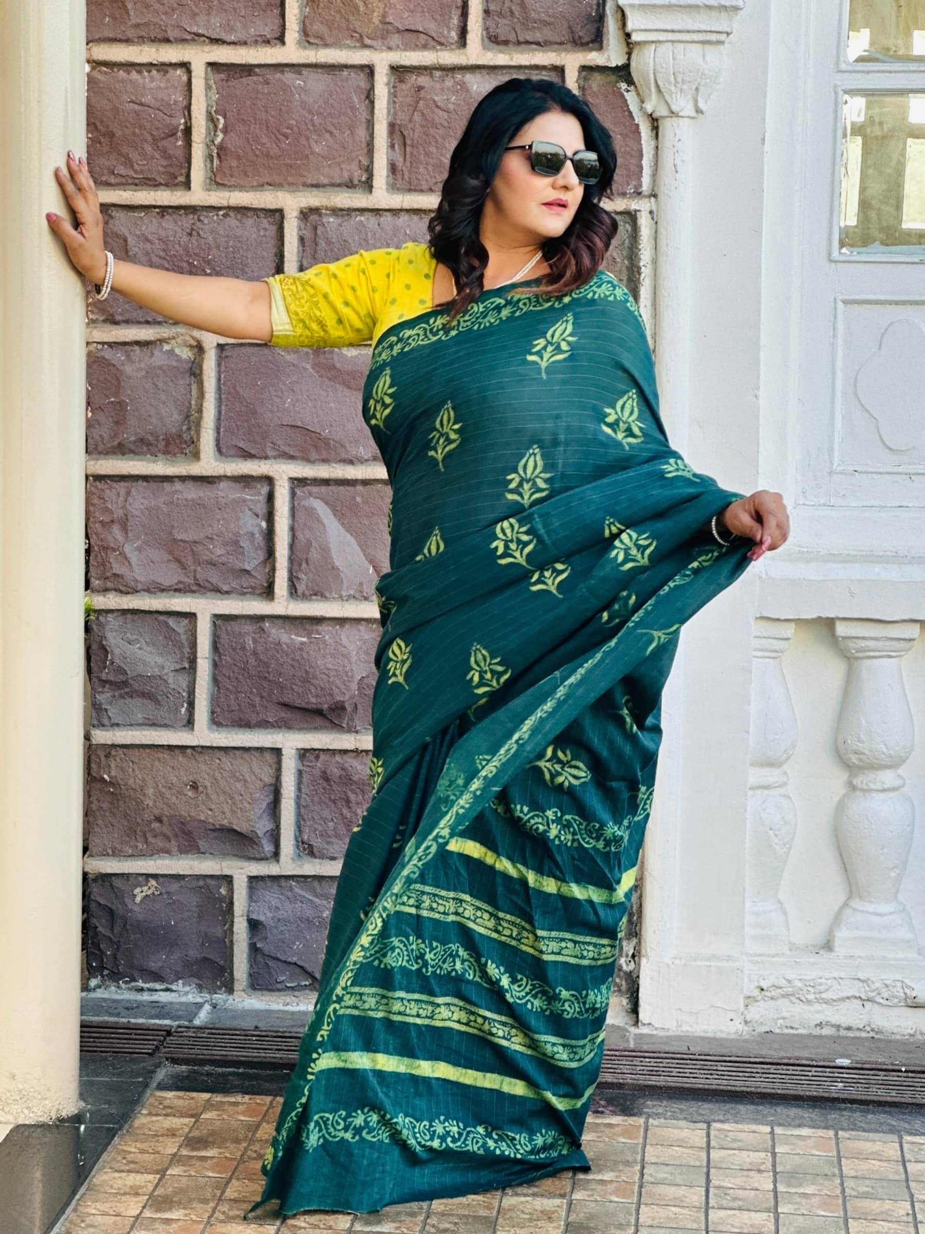 Deep green indigo hand block printed banana silk cotton saree