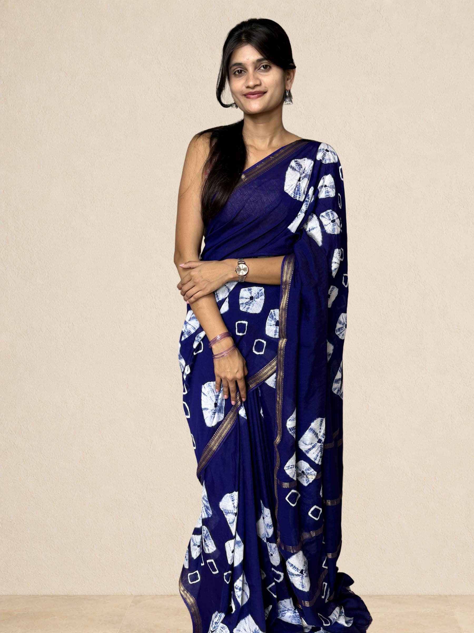Bandhej Maheshwari cotton silk saree in royal blue with handcrafted white tie-dye motifs and gold zari border