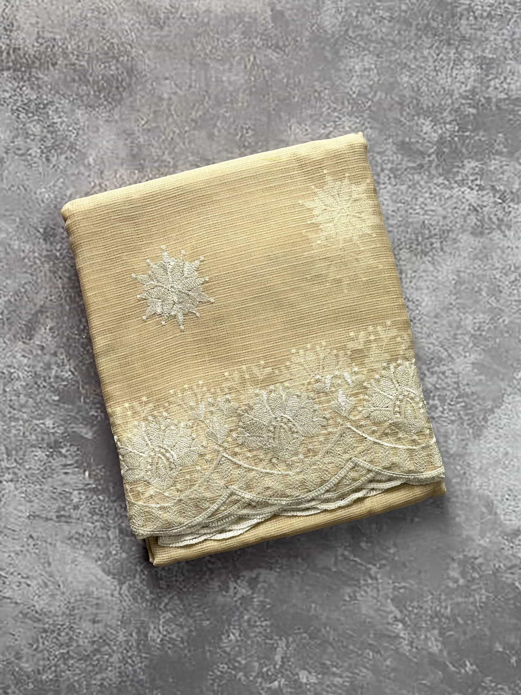 Beige Kota Doria embroidered saree with floral scalloped border