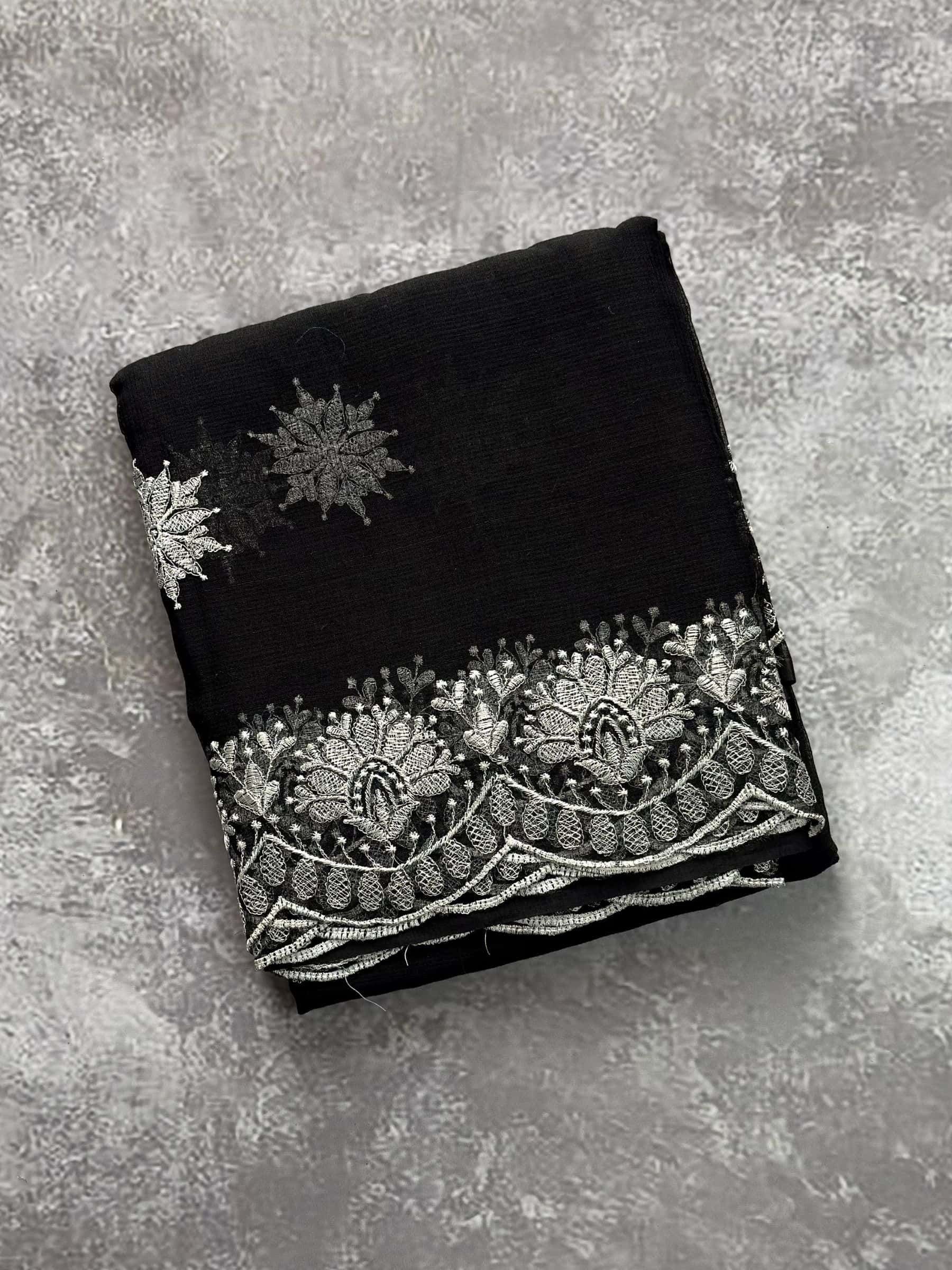 Black embroidered Kota Doria saree with silver floral border