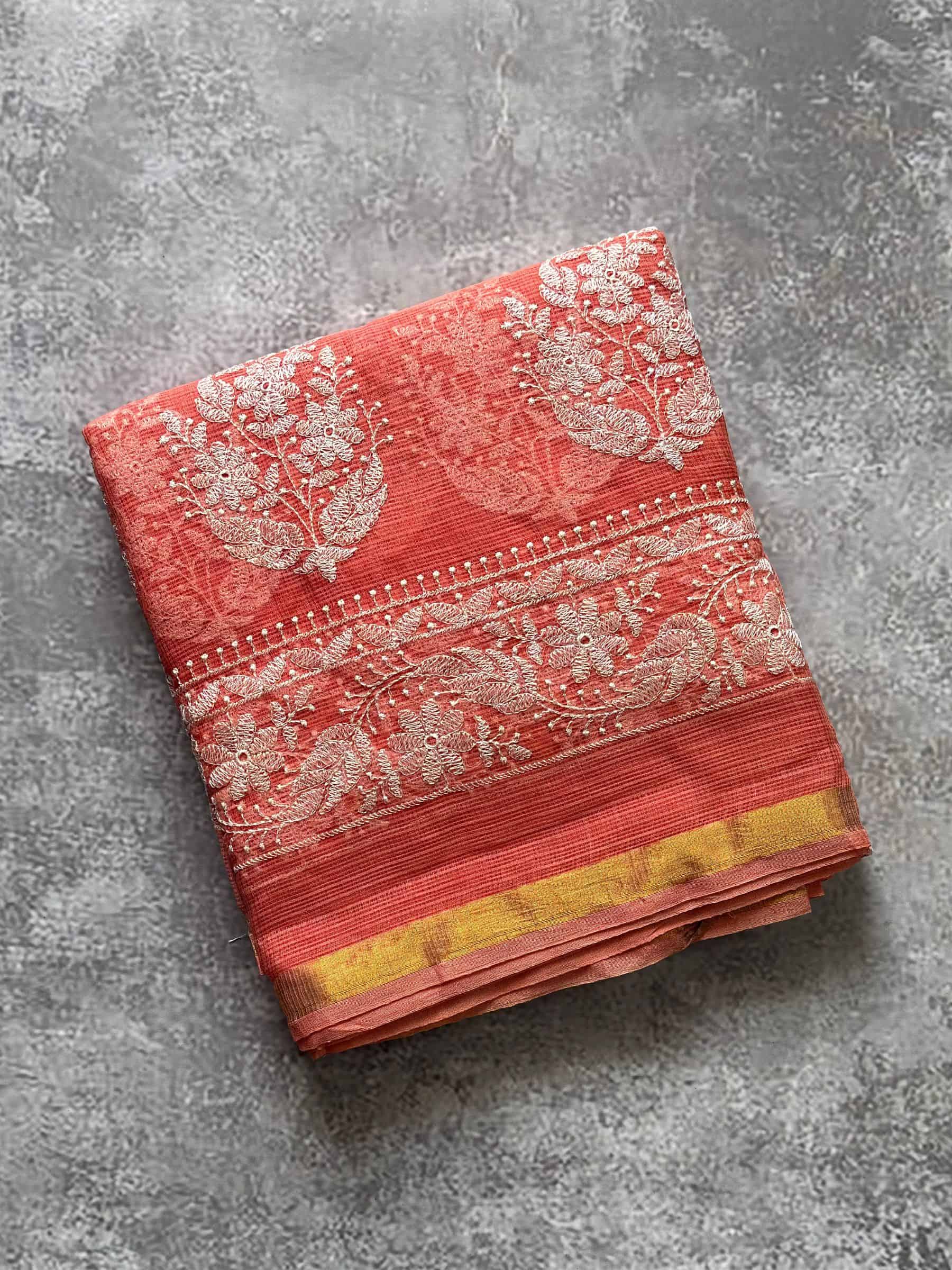 Coral red Kota Doria embroidered saree with floral pallu border