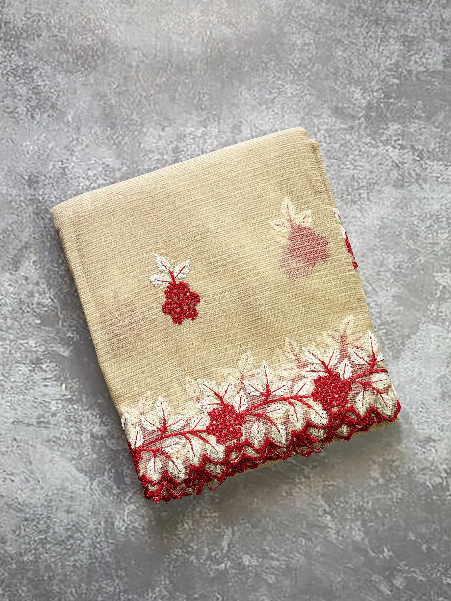 Beige embroidered Kota Doria saree with red floral motifs