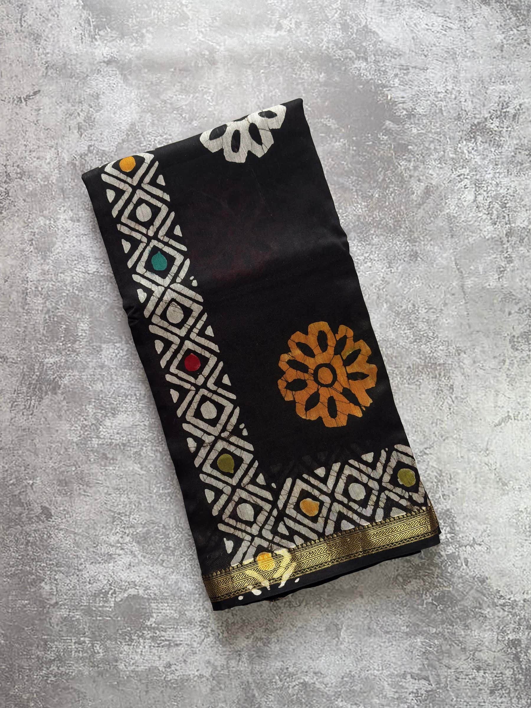 Black hand block printed Maheshwari silk cotton saree with multicolor motifs