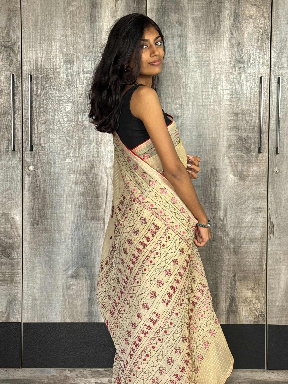 Handloom beige cotton saree with geometric and floral hand embroidery