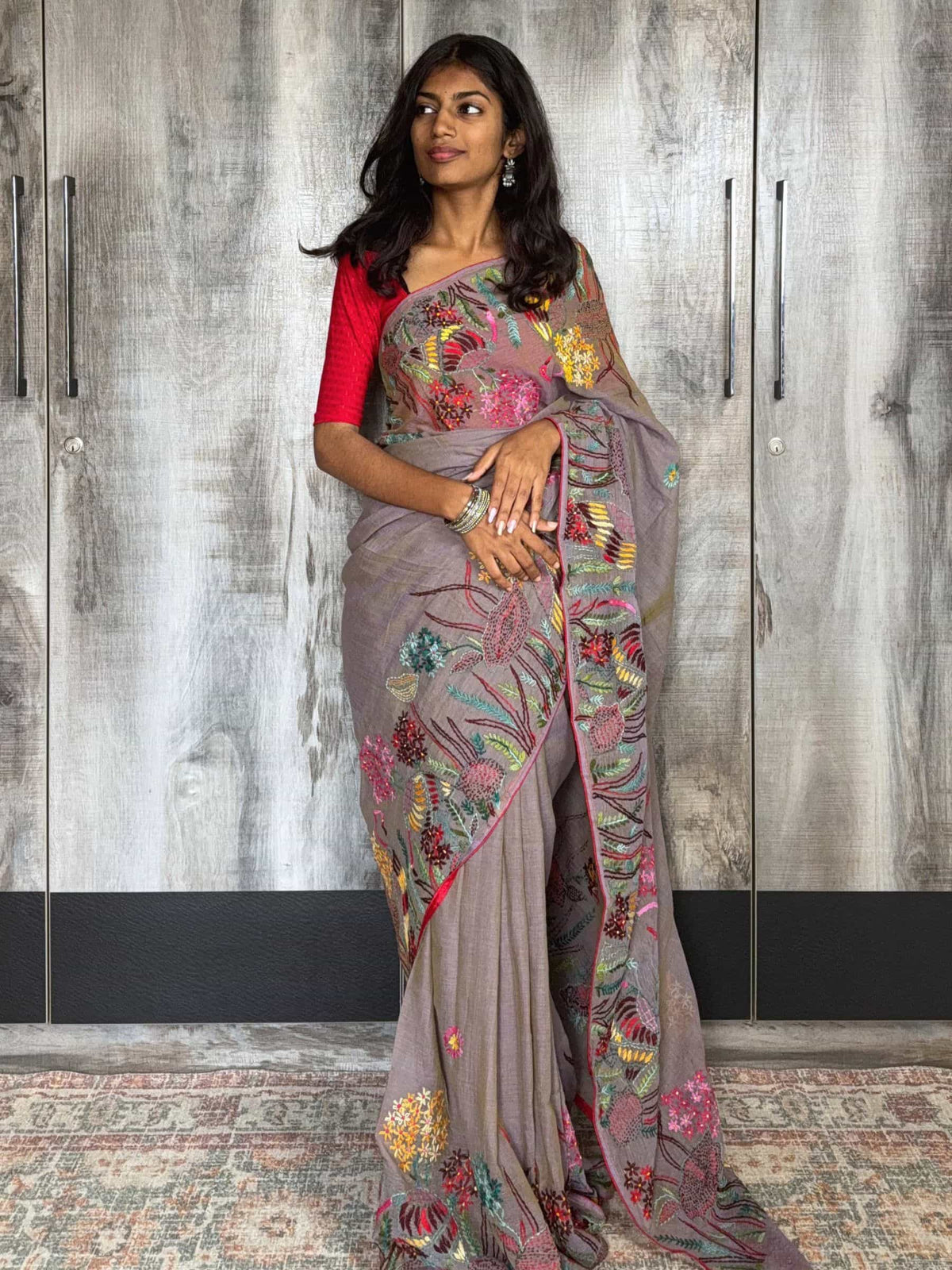 Handloom Dhonekhali cotton saree in grey with colorful hand embroidery