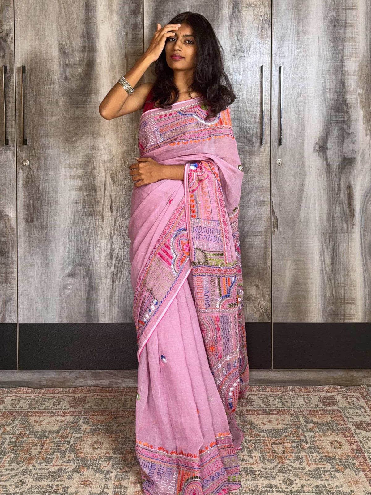 Handloom Dhonekhali cotton saree in pink with colorful hand embroidery