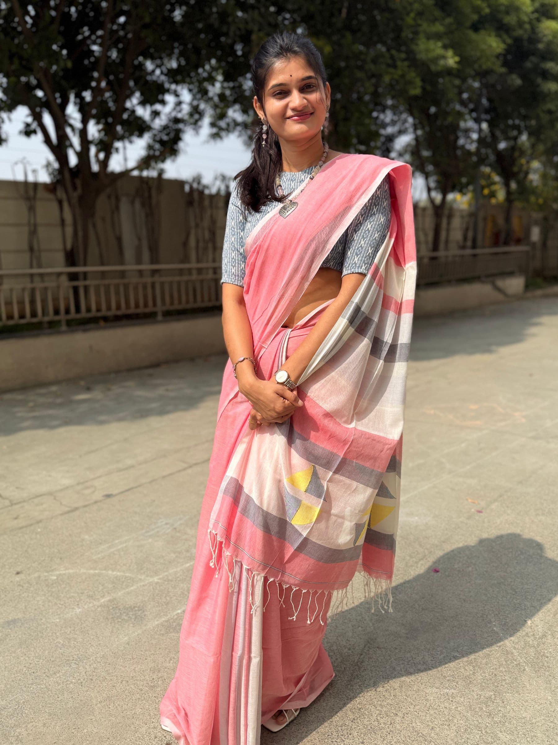 Handloom cotton Jamdani saree in soft pink with check patterns