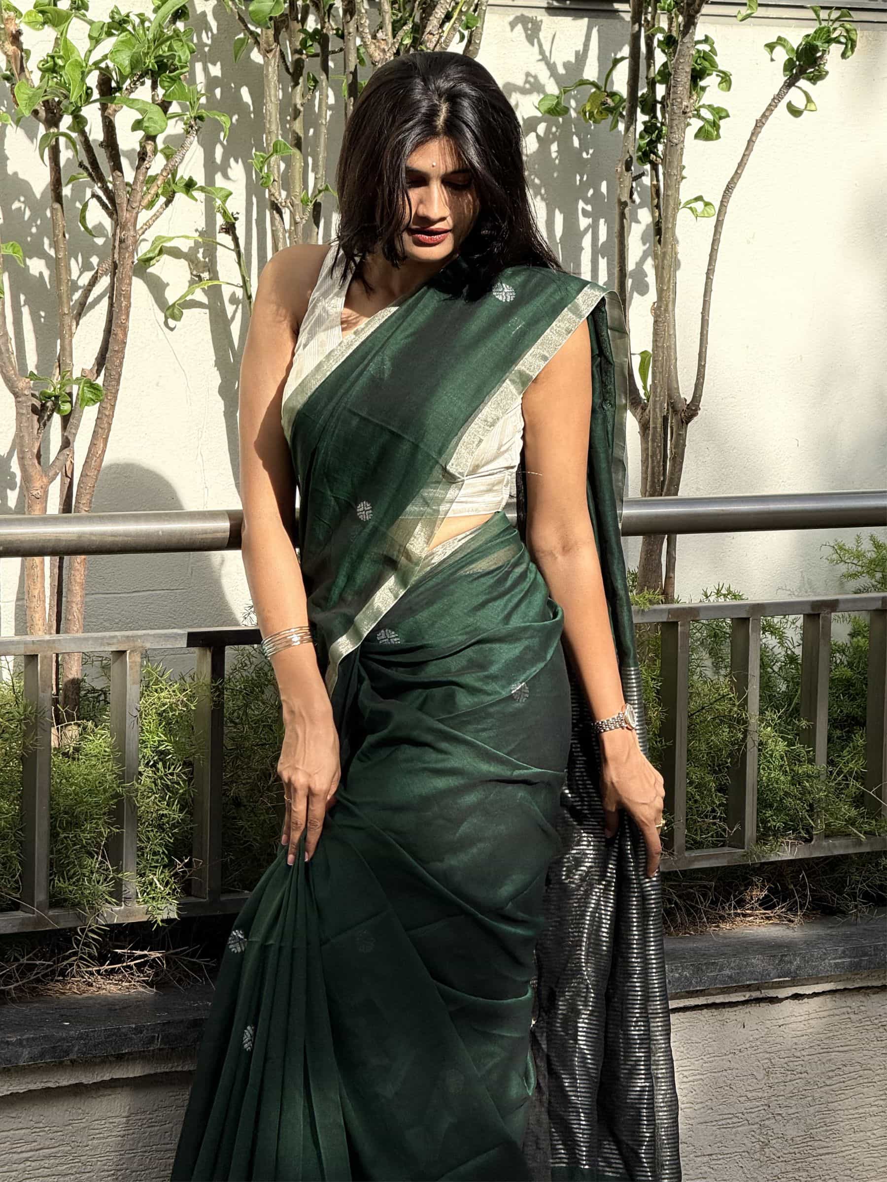 Handloom mercerized cotton saree in emerald green with silver zari border and woven buttas