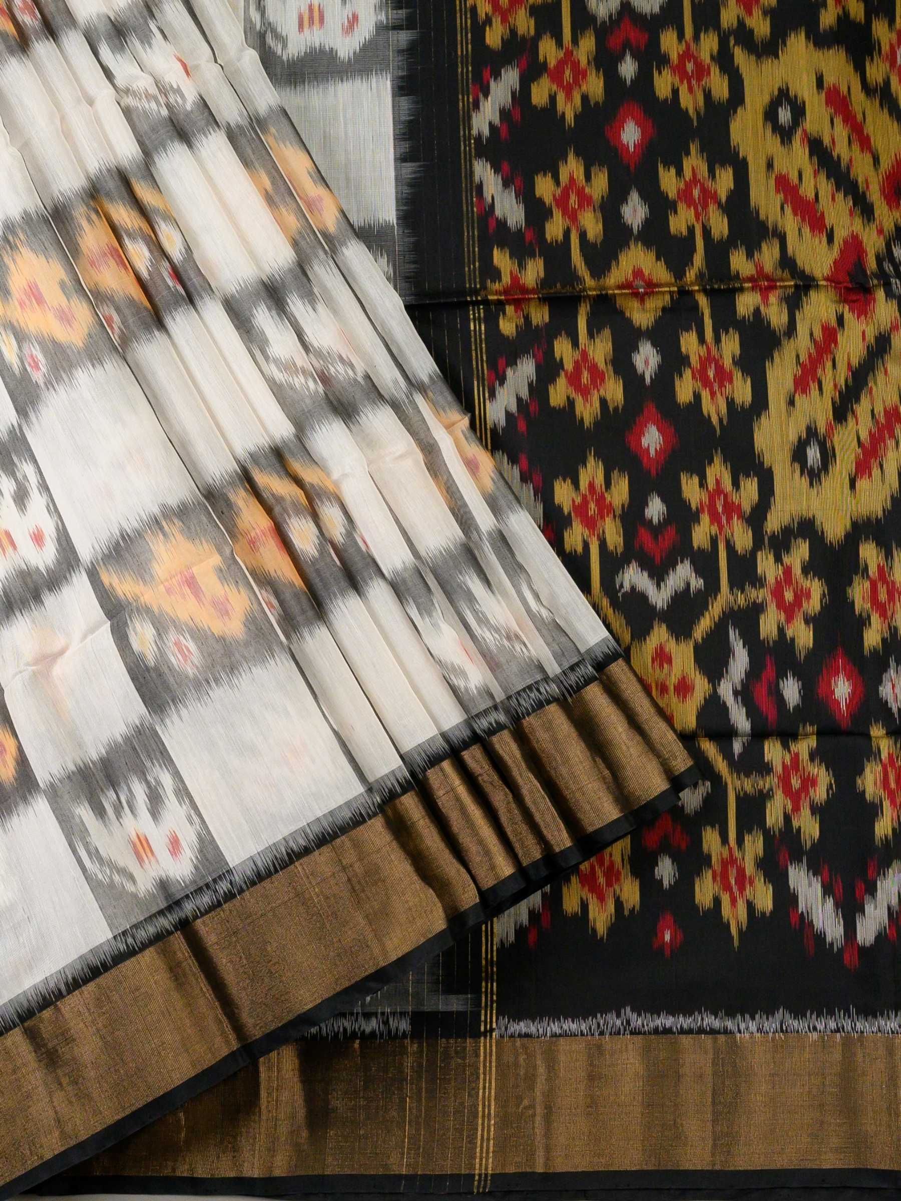 Handloom Pochampally Silk Cotton Saree in White and Black with Floral Ikat Design