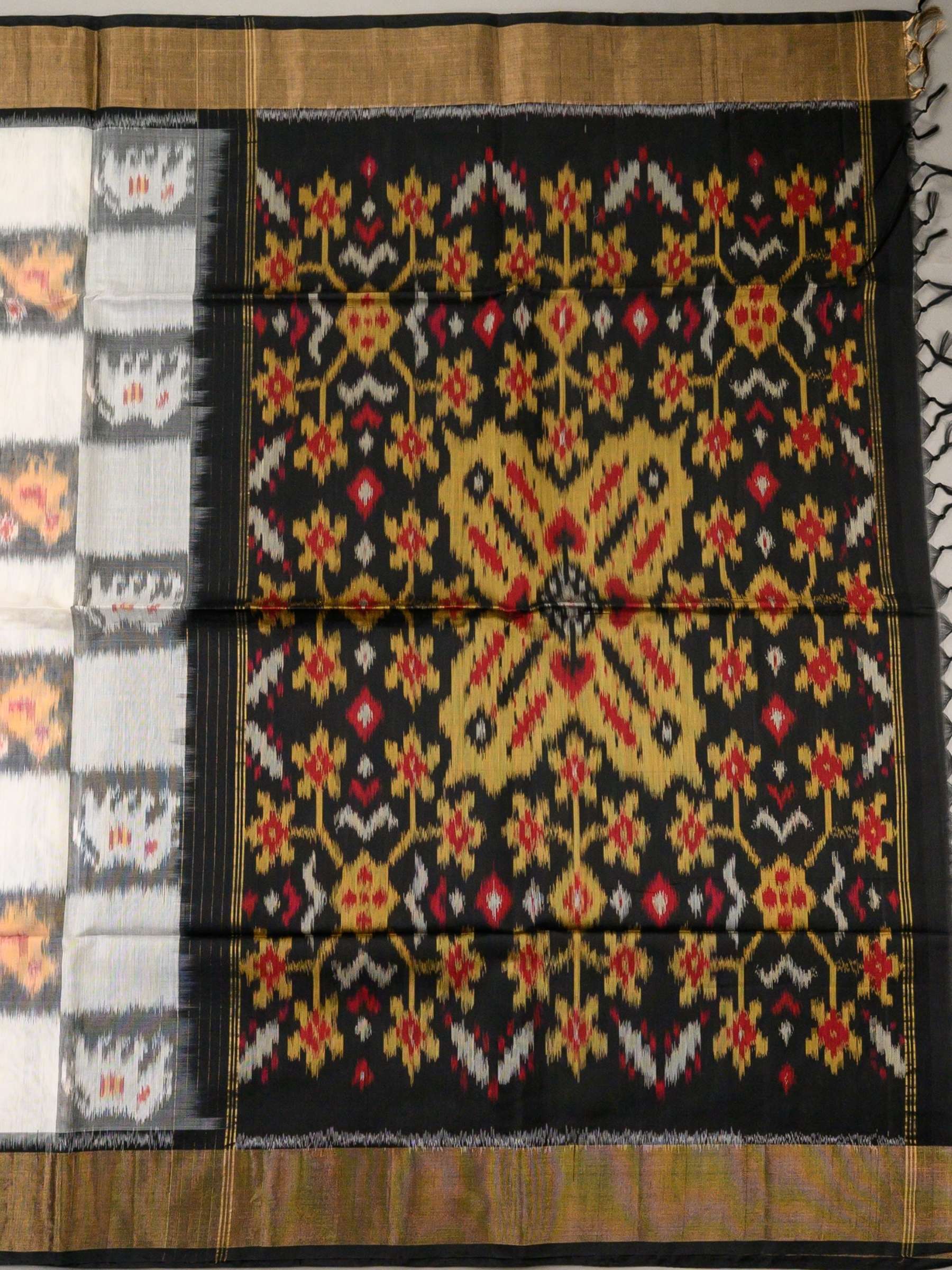 Handloom Pochampally Silk Cotton Saree in White and Black with Floral Ikat Design