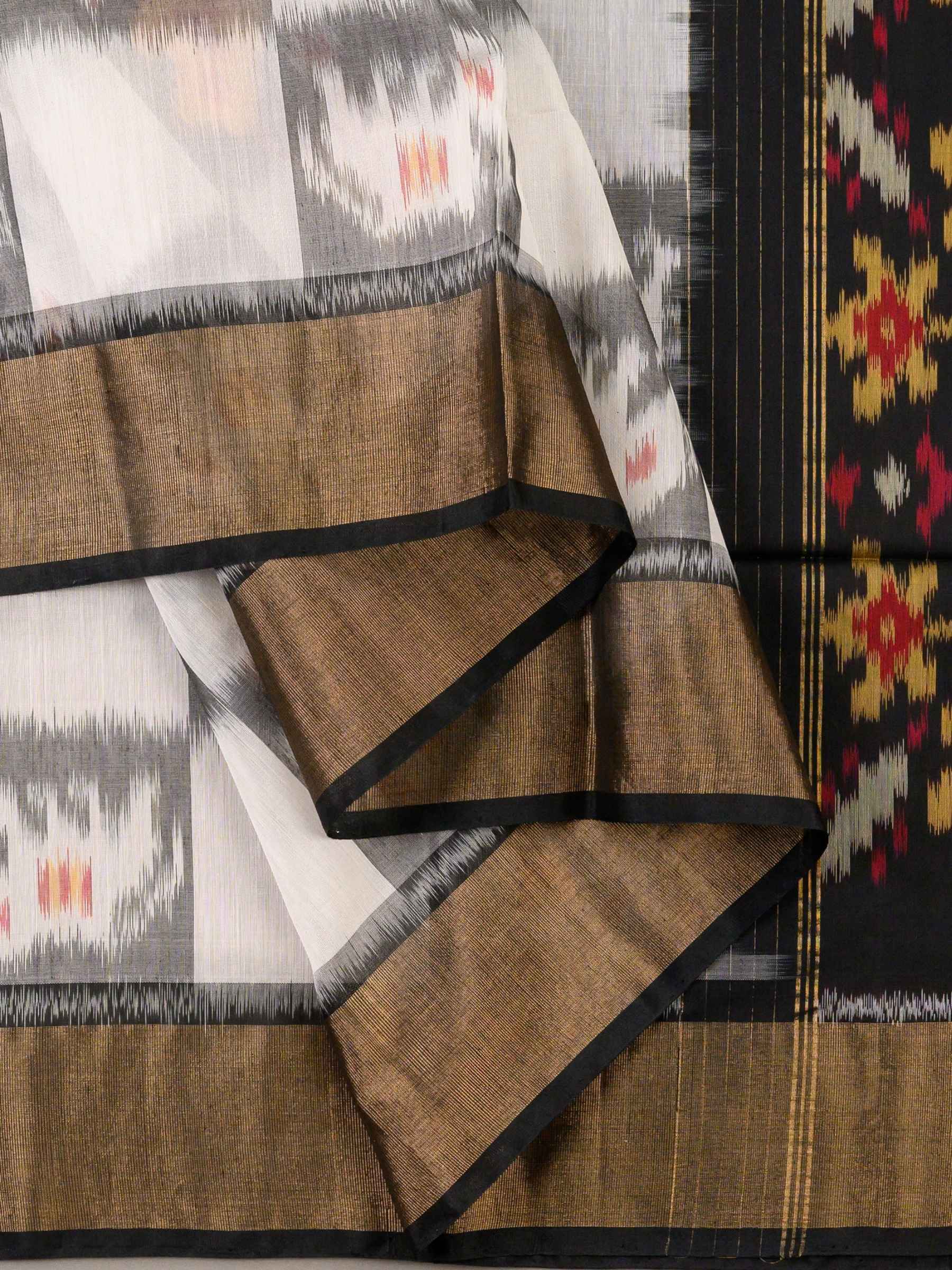 Handloom Pochampally Silk Cotton Saree in White and Black with Floral Ikat Design