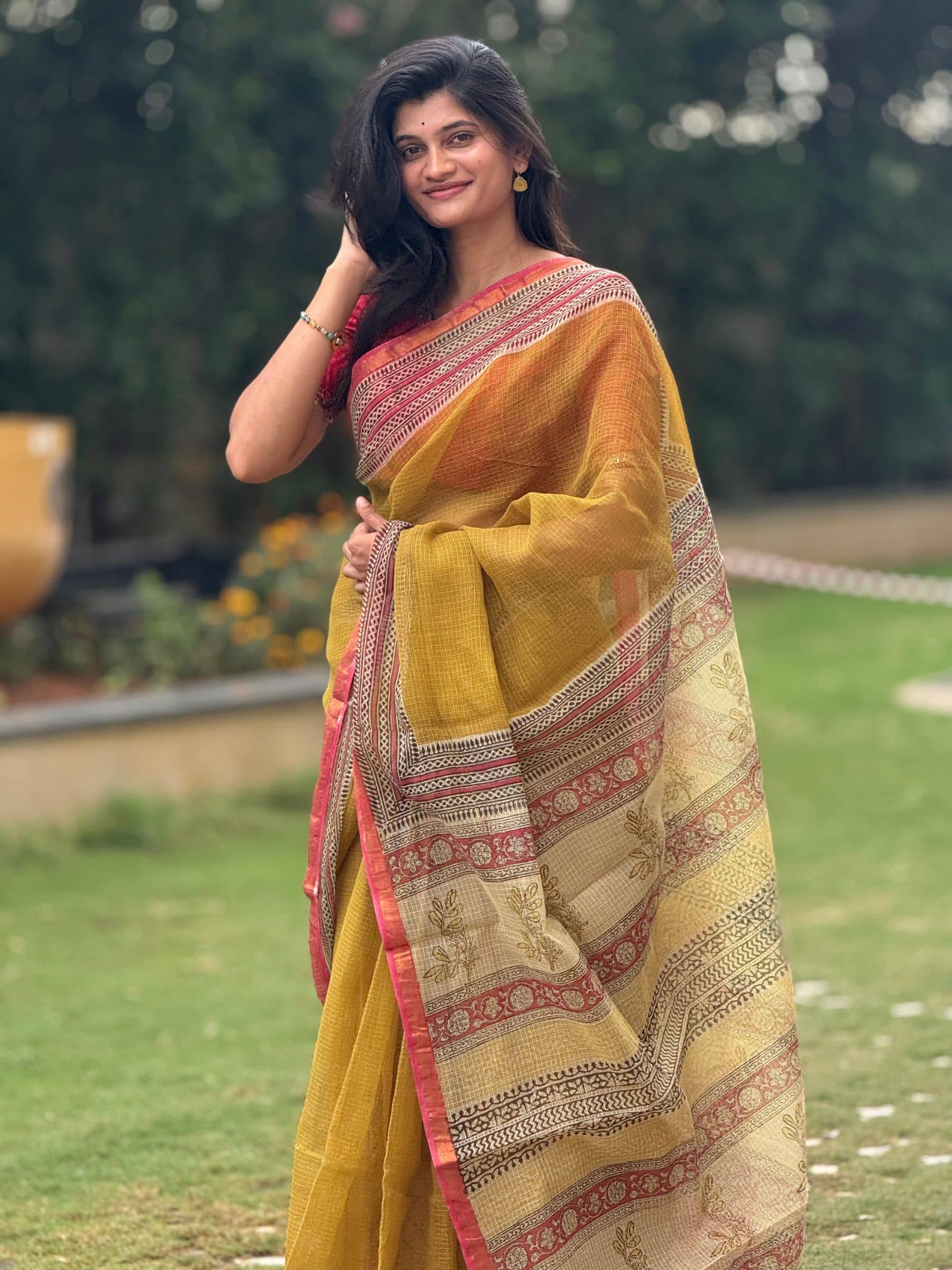 Mustard yellow Bagru hand block printed Kota Doria saree