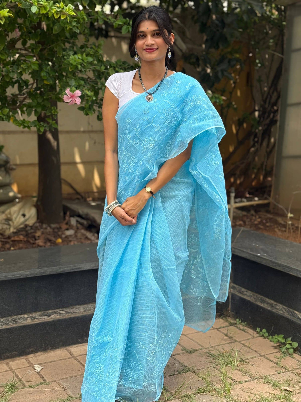 Blue Kota Doria saree with white floral embroidery