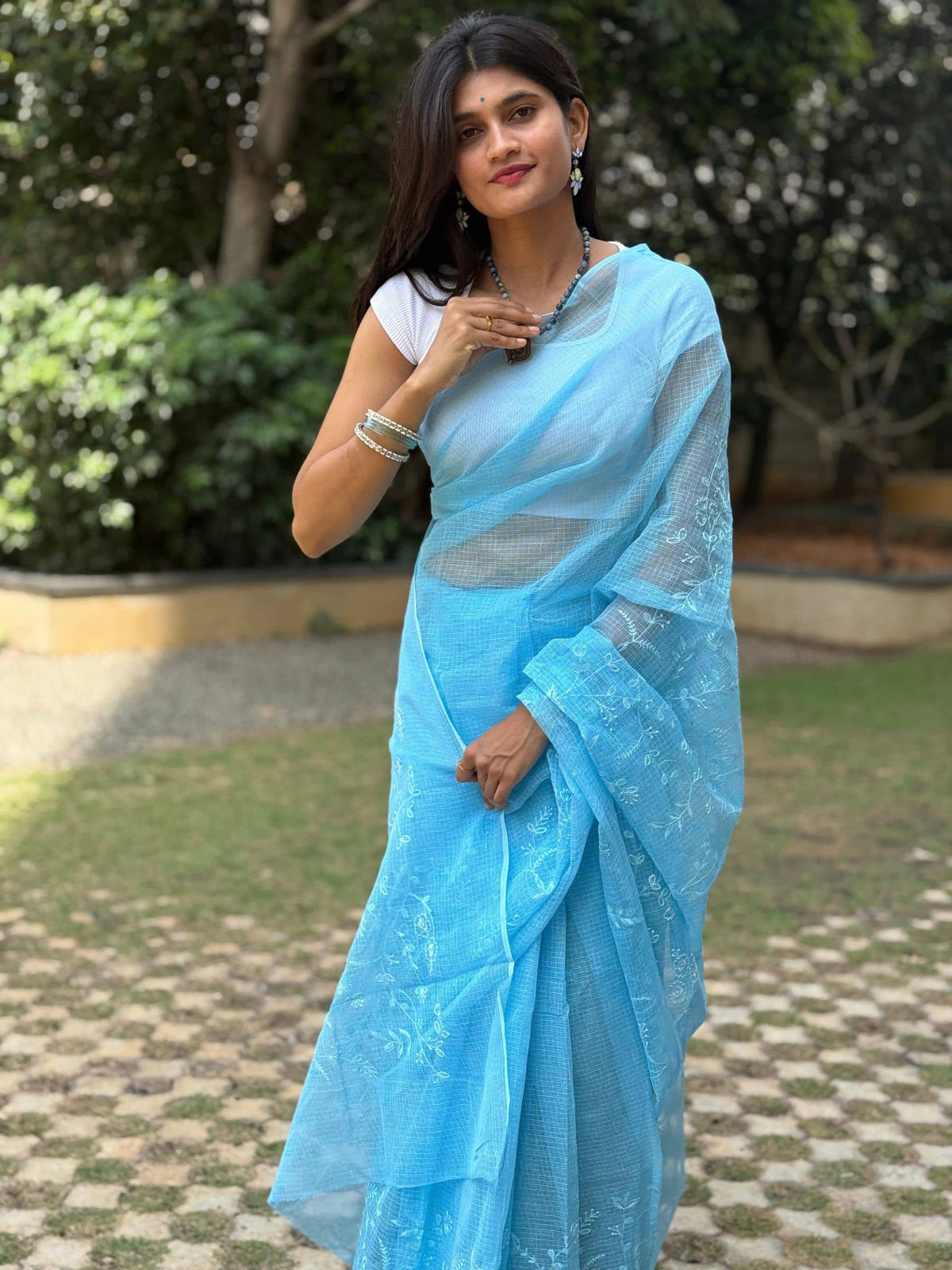 Blue embroidered Kota Doria saree with floral motifs