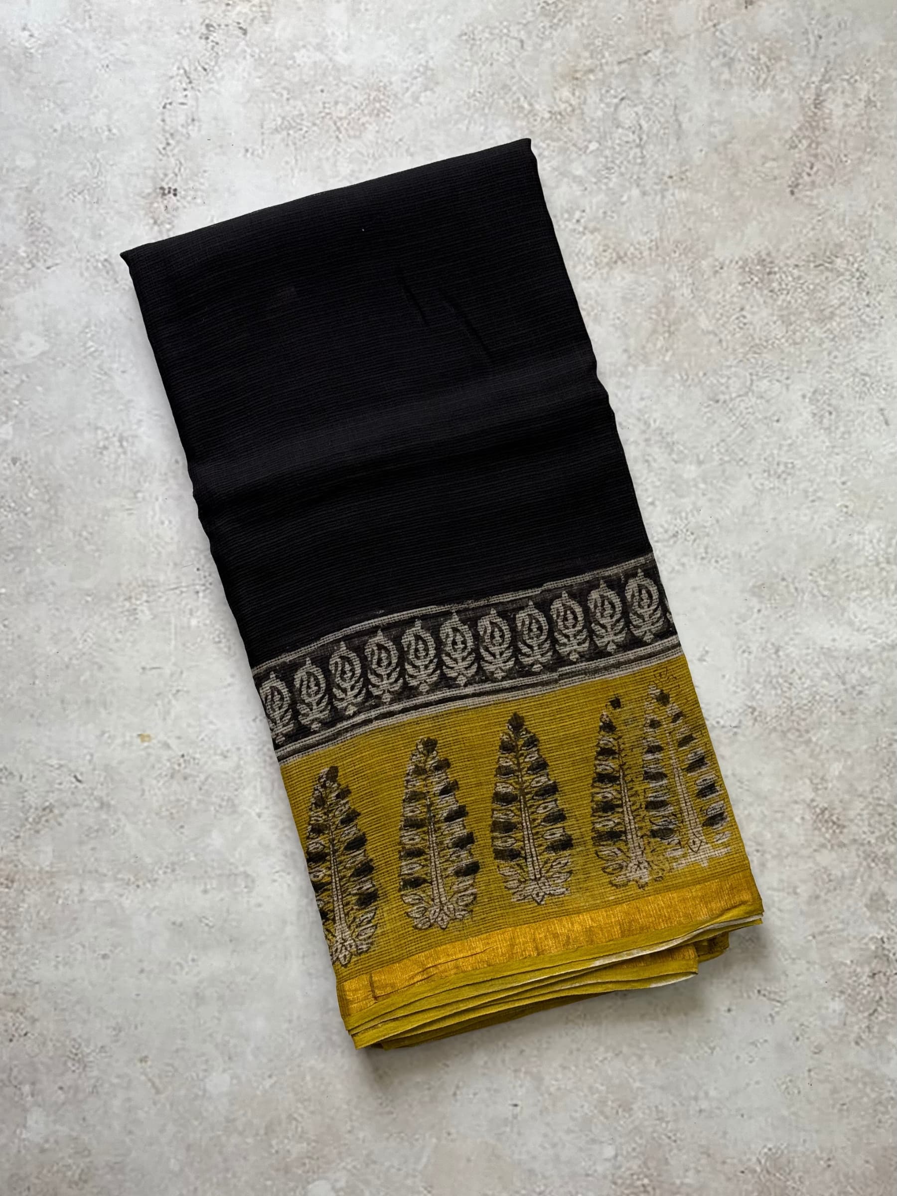 Black Kota Doria saree with mustard block print