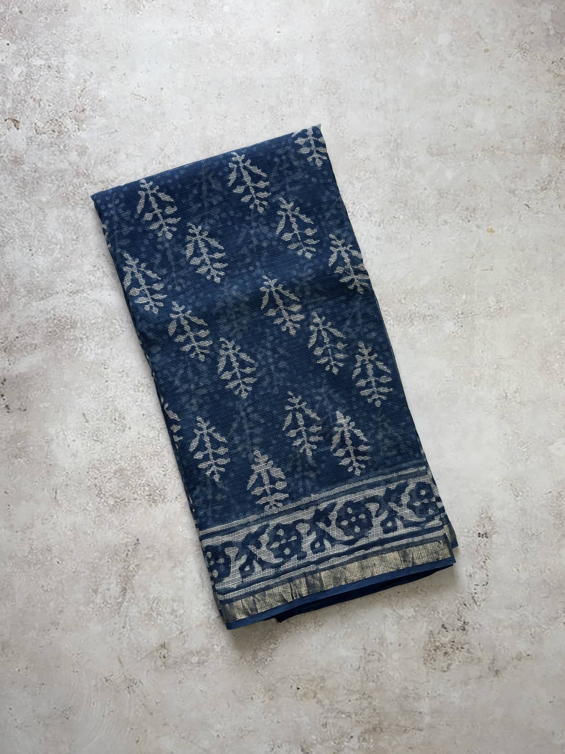 Indigo blue hand block printed Kota Doria saree with floral buta motifs