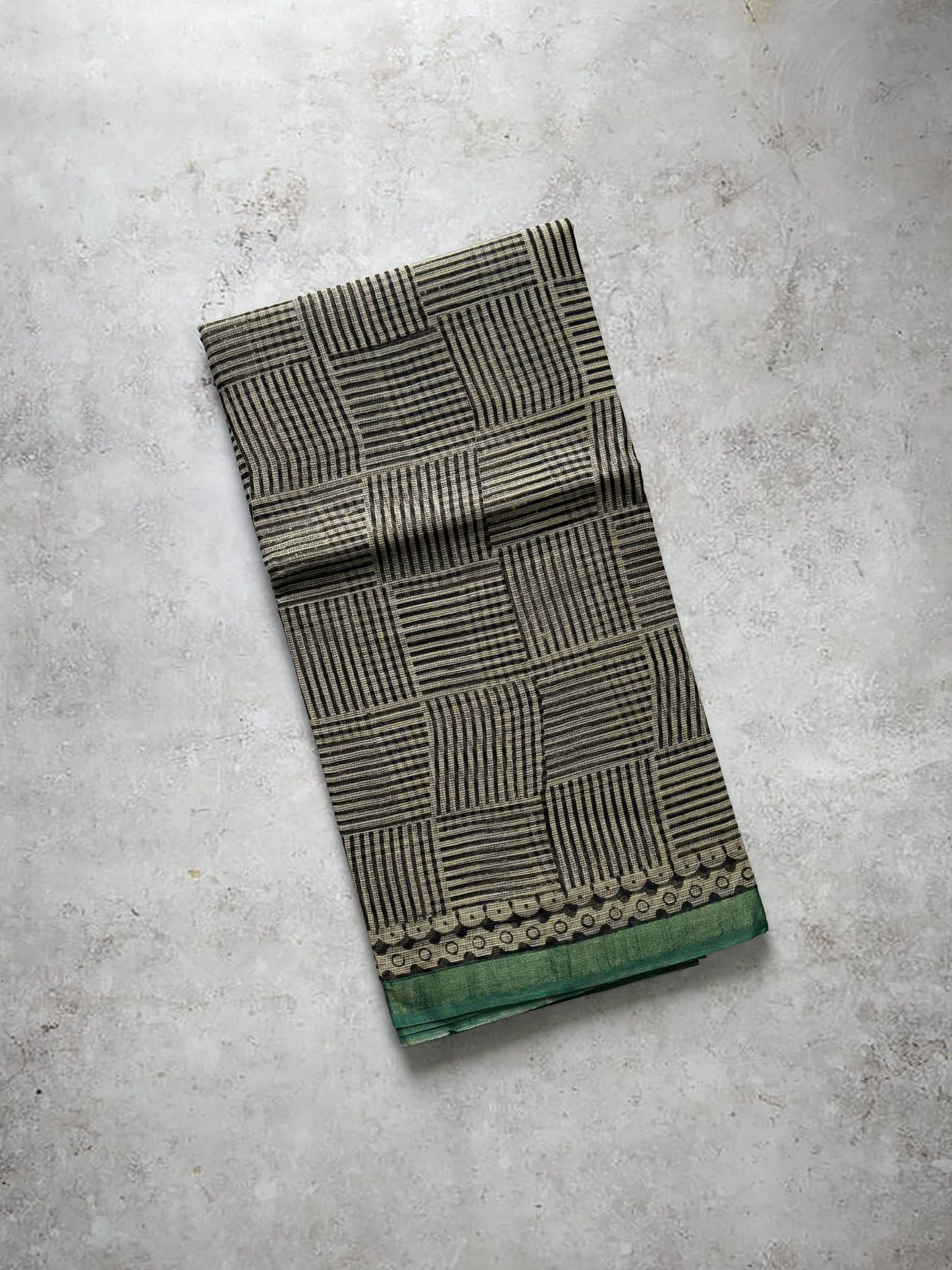 Mustard hand block printed Kota Doria saree with geometric pattern and green border