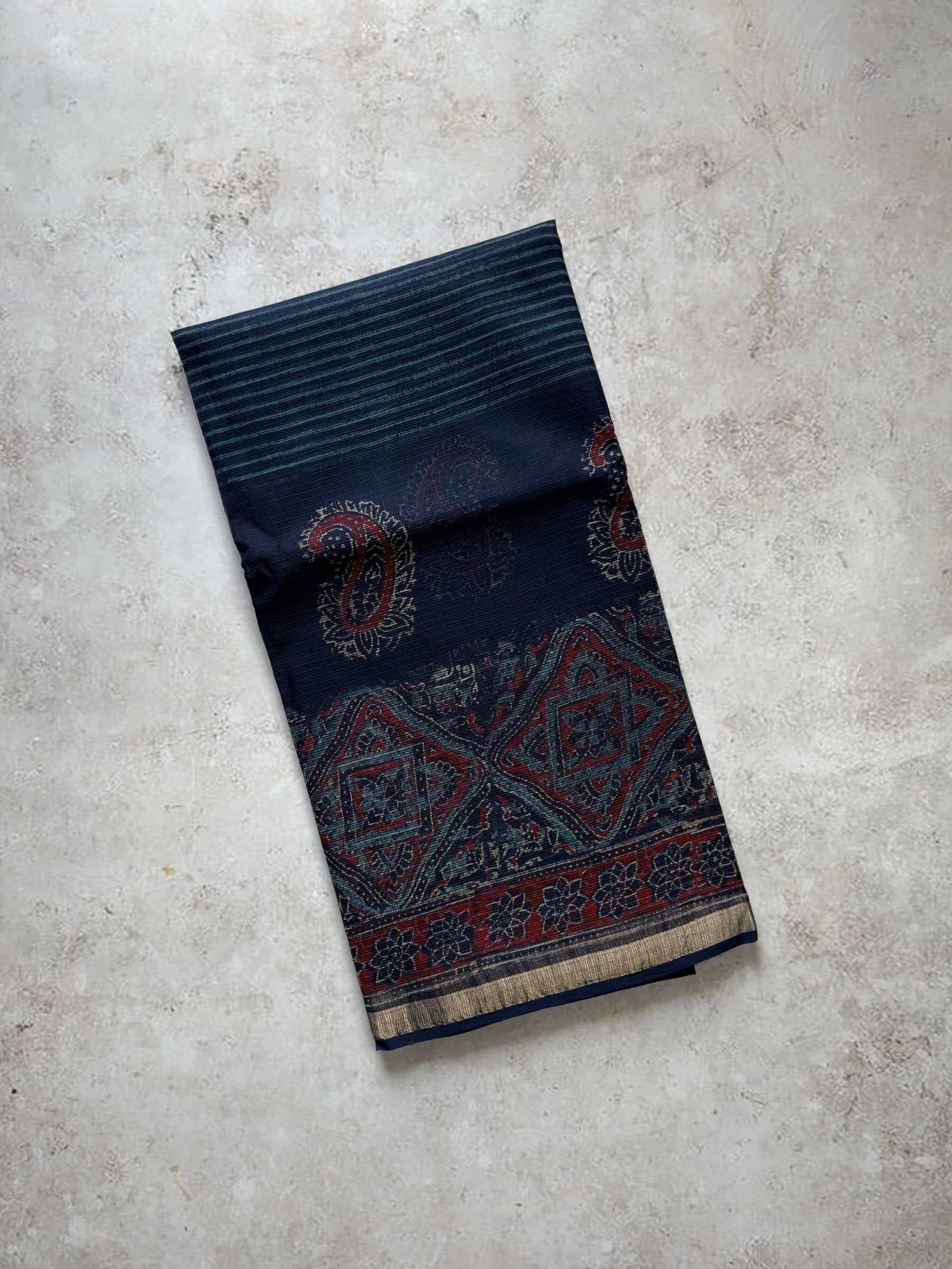 Navy blue hand block printed Kota Doria saree with Ajrakh inspired patterns