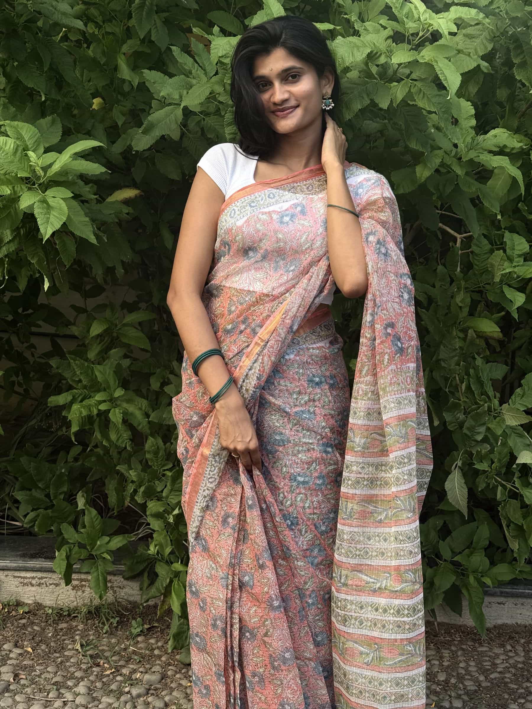 Hand block printed Sanganeri Kota Doria saree in coral pink with floral jaal pattern