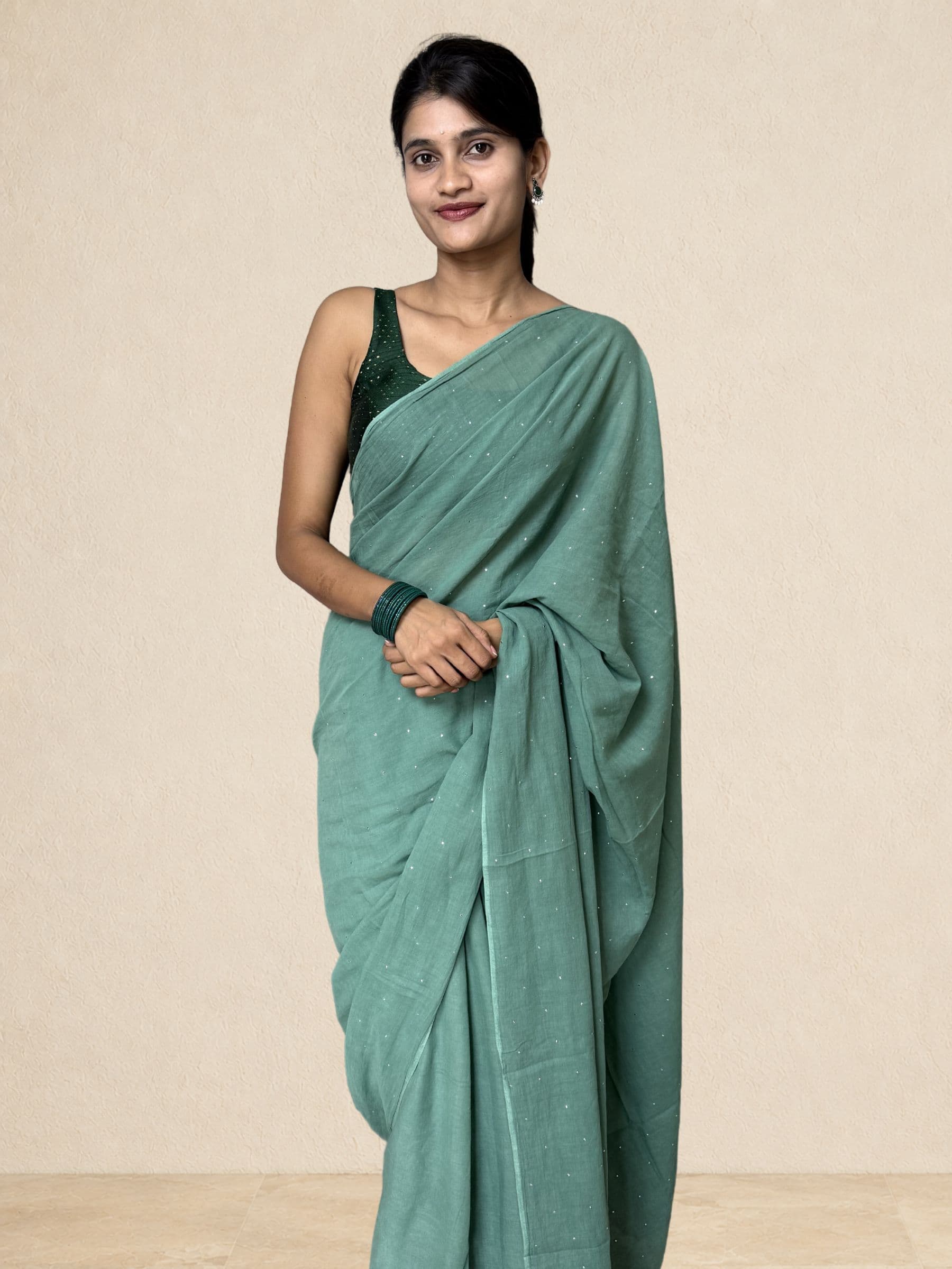 Teal green Mukaish mul cotton saree with handcrafted Mukaish work and crochet edging