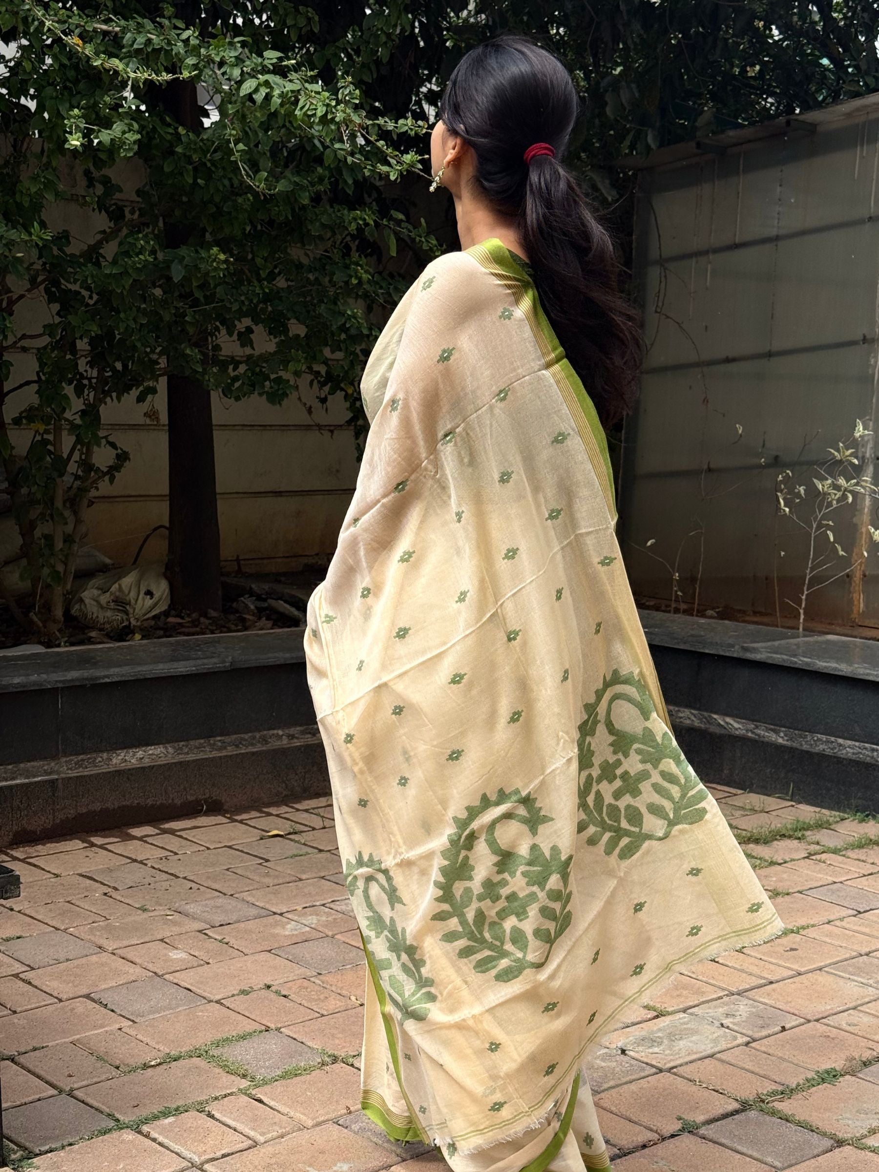 Handloom Needle Jamdani saree with botanical motifs and green border