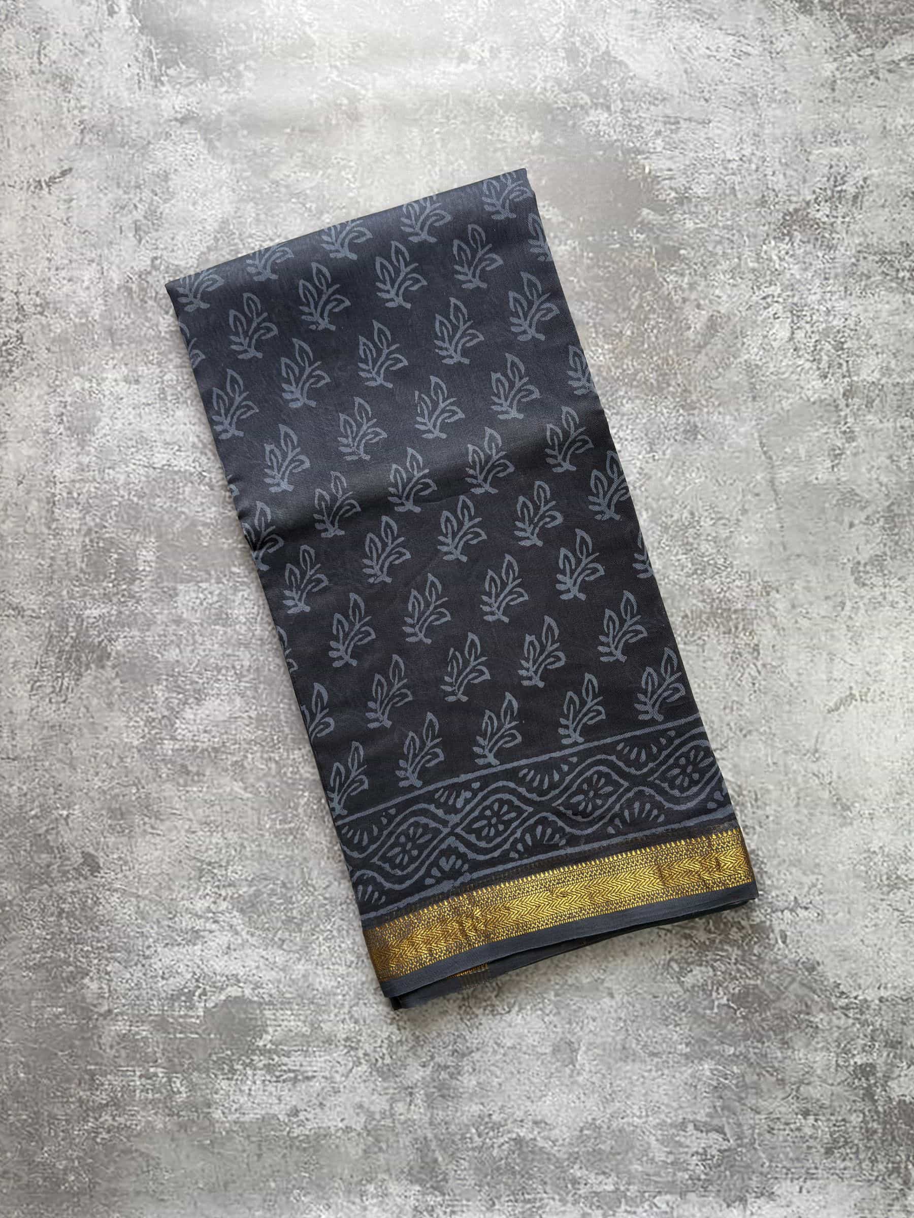 Charcoal grey hand block printed Maheshwari silk cotton saree with zari border