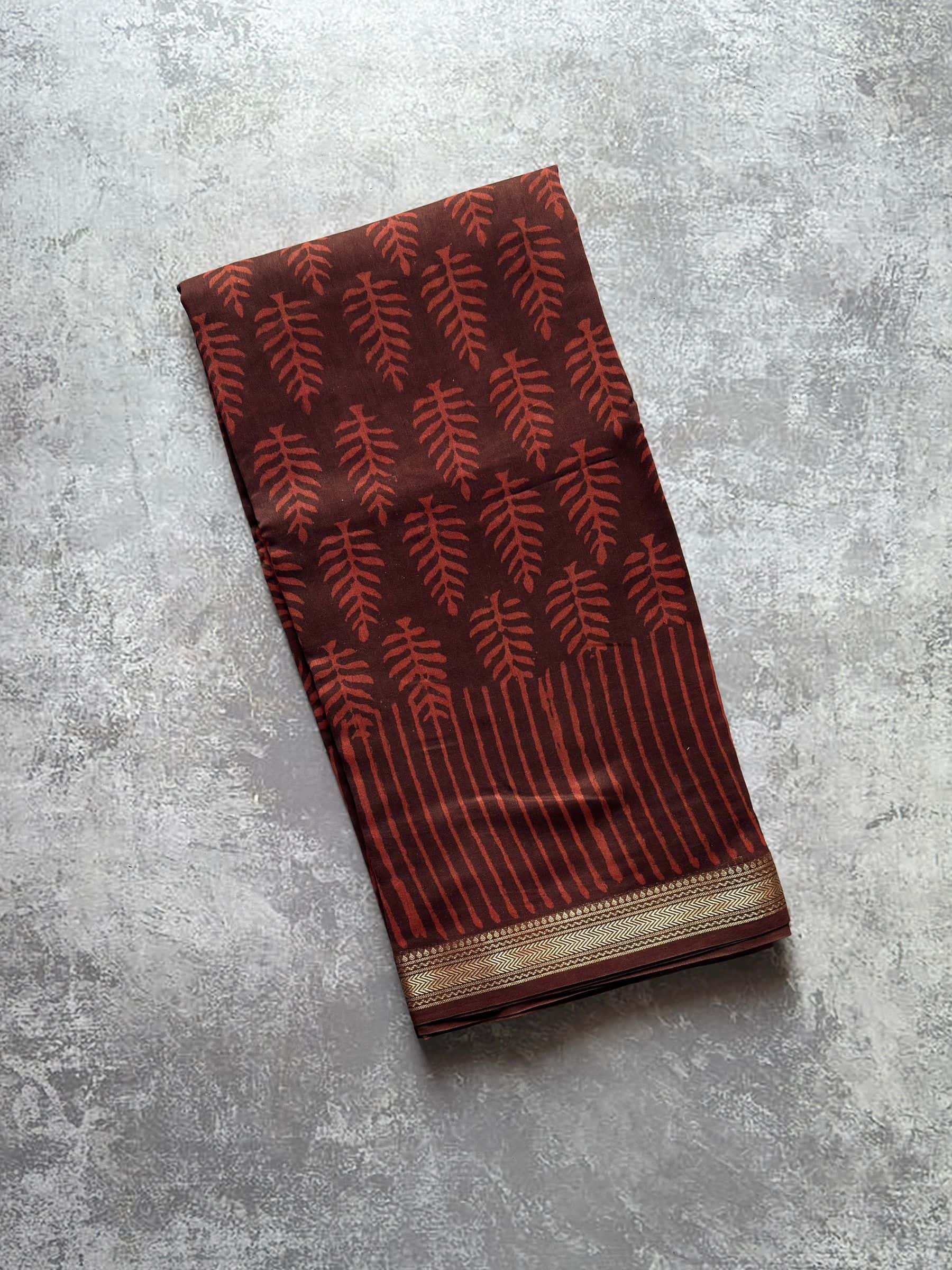 Rust brown hand block printed Maheshwari silk cotton saree body with leaf motifs