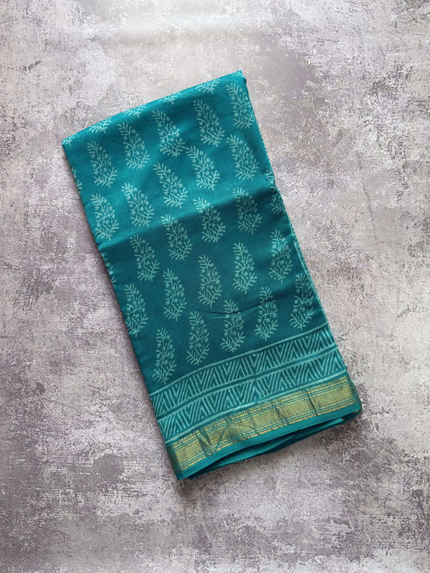 Teal green hand block printed Maheshwari silk cotton saree with floral motifs