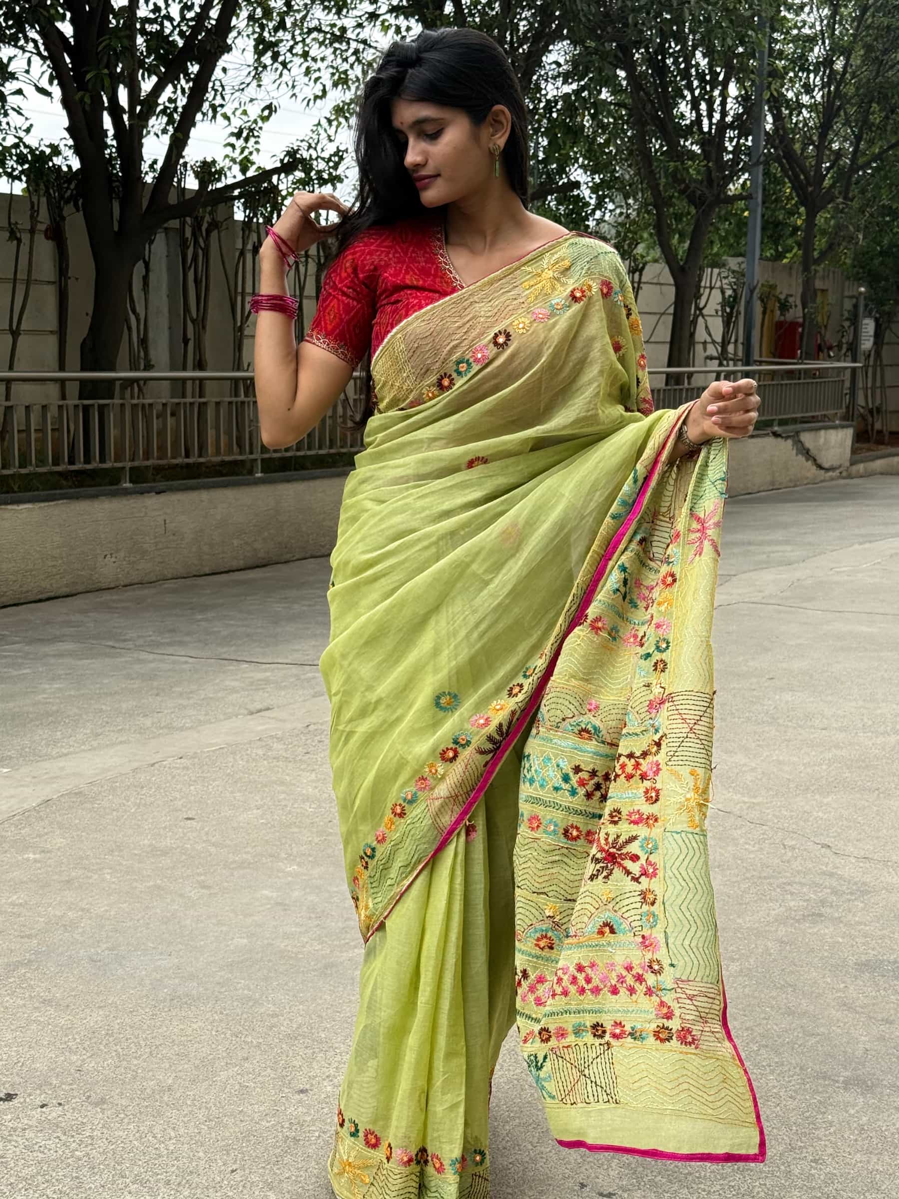 Pistachio green Dhonekhali Tant saree with colorful floral hand embroidery