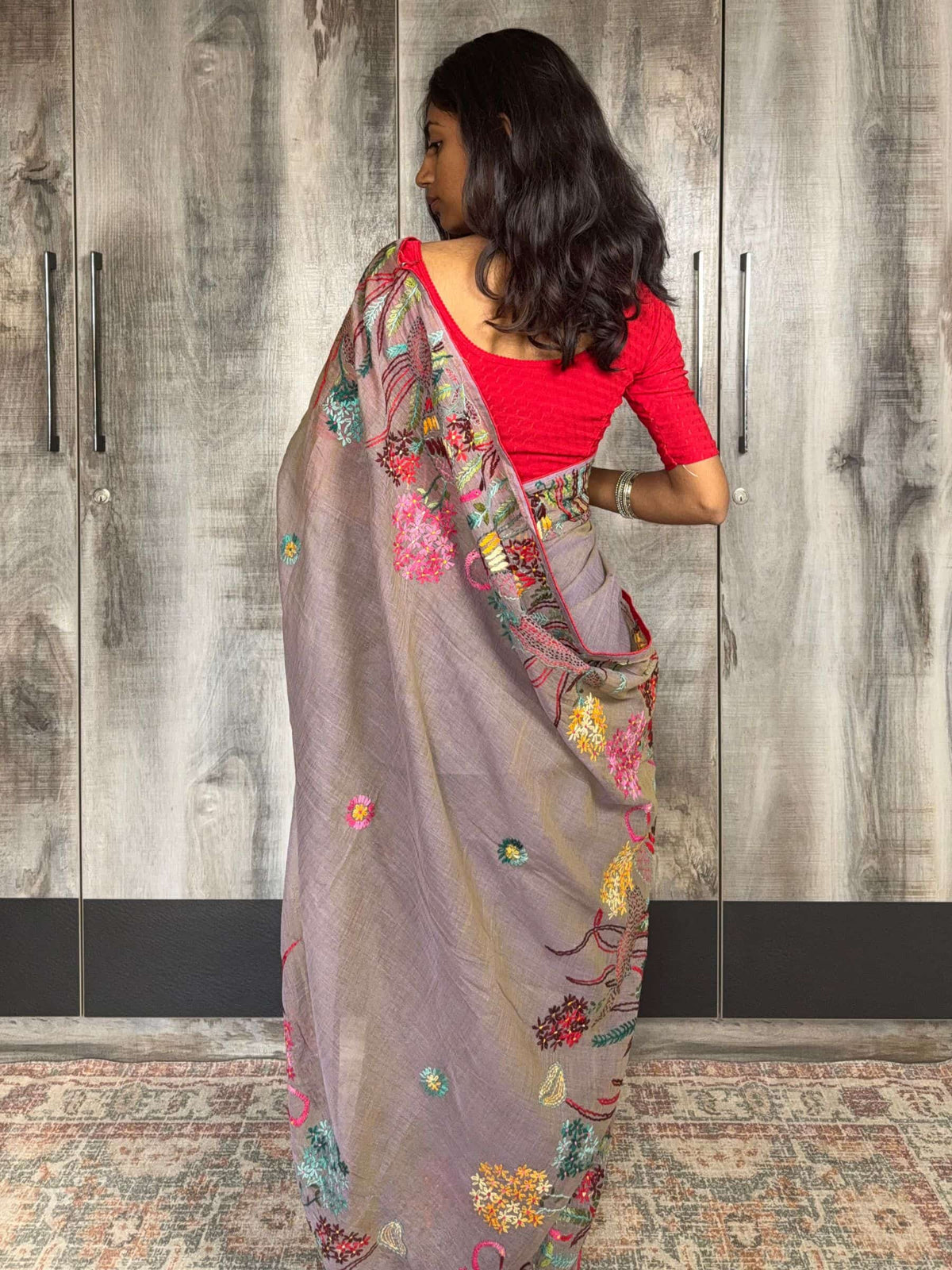 Handloom grey cotton saree with multicolor embroidered border and pallu