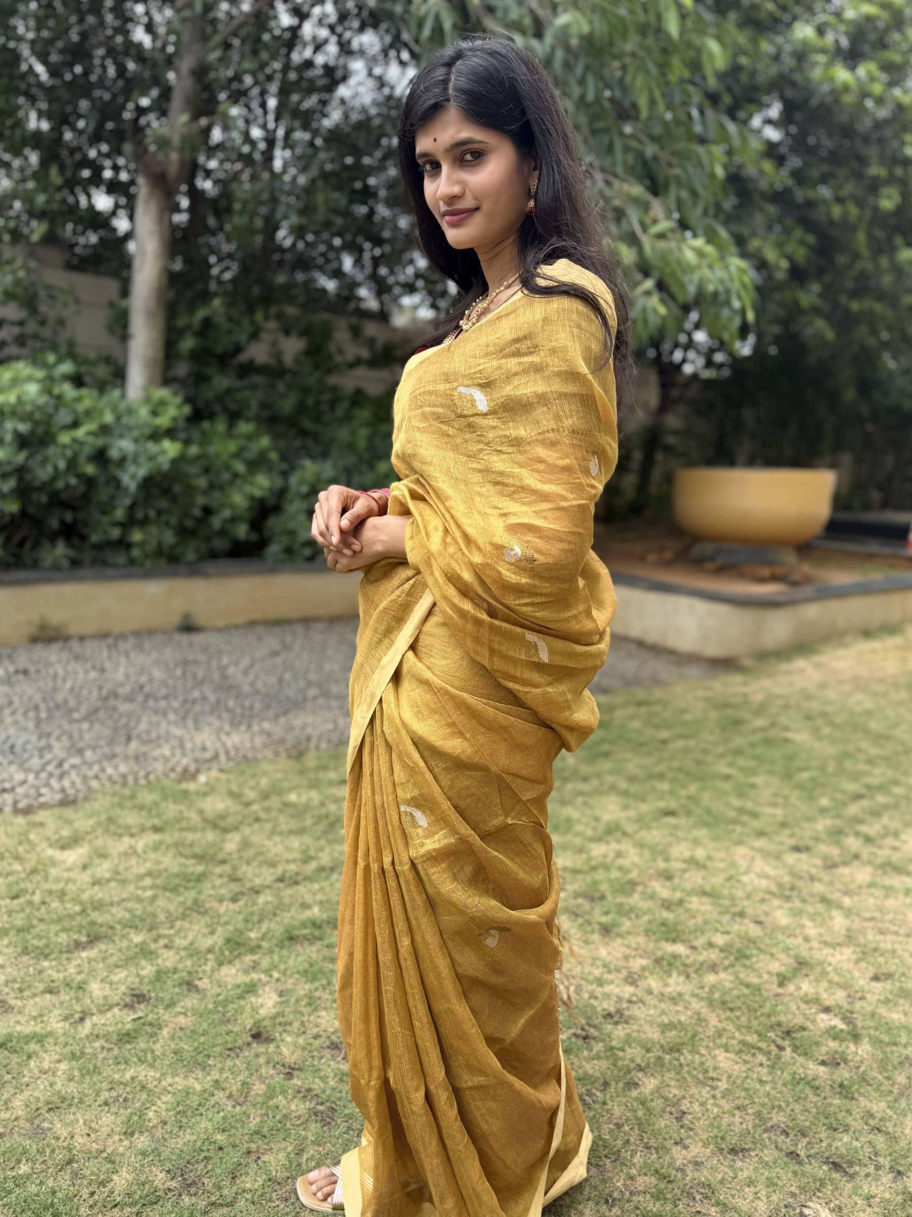 Golden handloom tissue linen saree with soft sheen