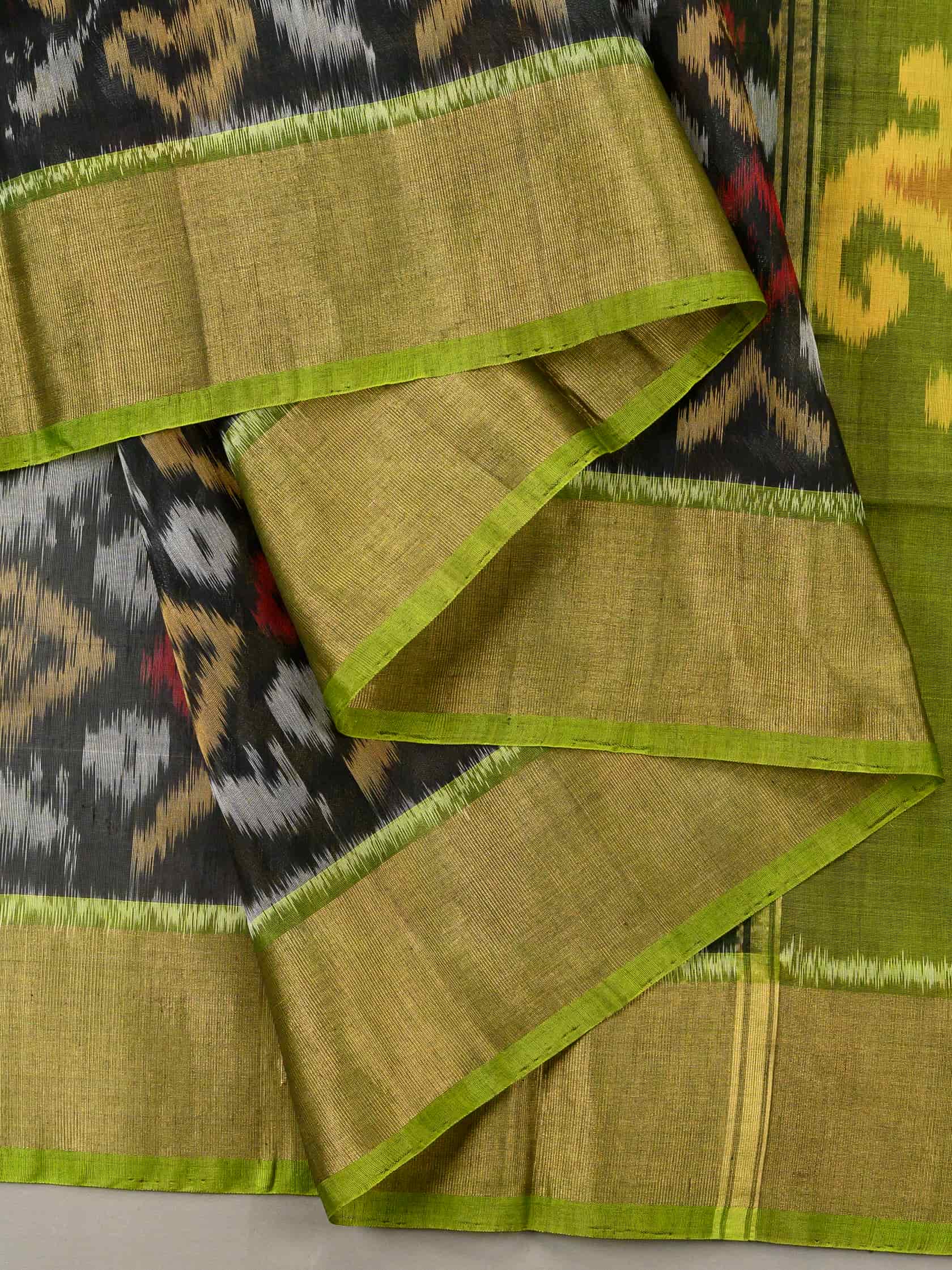 Handloom Pochampally Silk Cotton Saree in Black and Green with Ikat Floral Weave