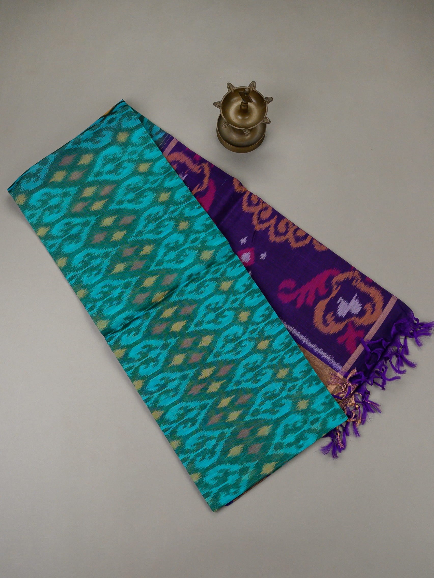 Handloom Pochampally silk cotton saree in teal blue and purple with floral Ikat weave