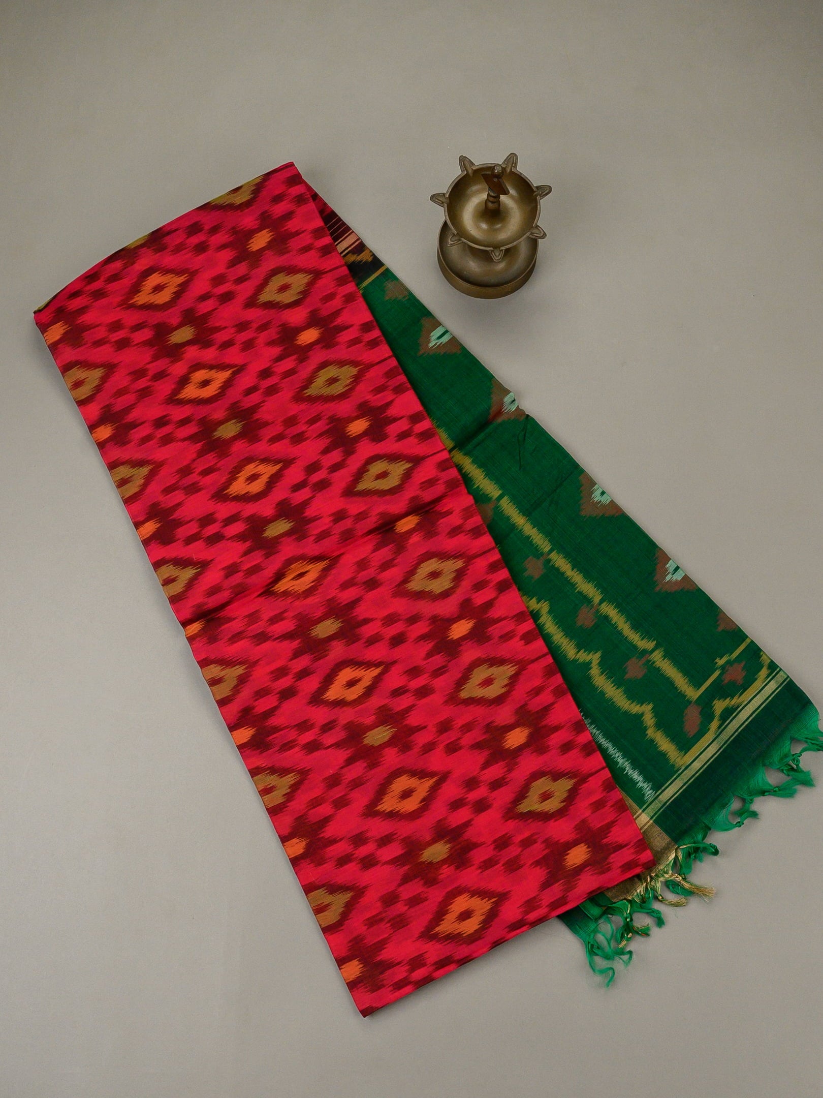 Handloom Pochampally silk cotton saree in red and green with geometric Ikat design