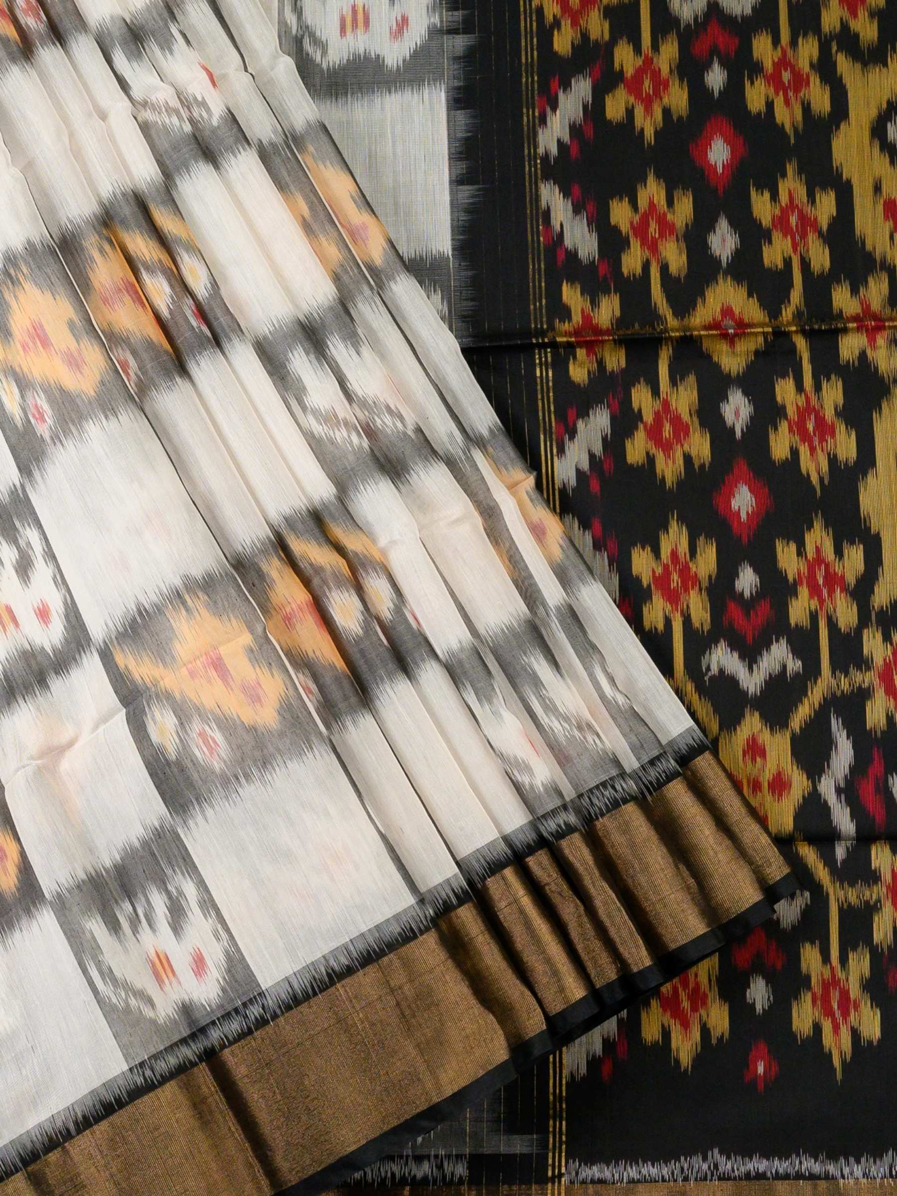 Handloom Pochampally Silk Cotton Saree in White and Black with Floral Ikat Design