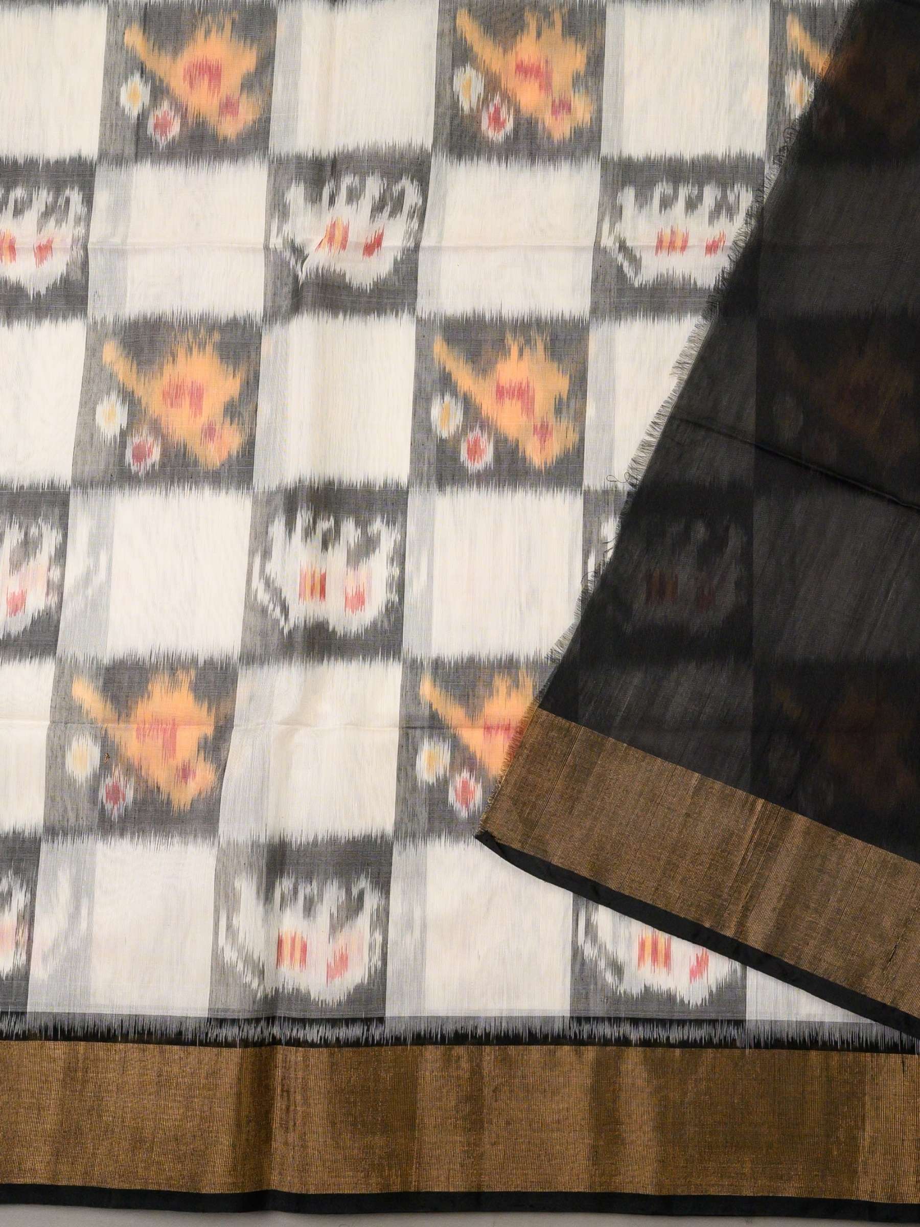 Handloom Pochampally Silk Cotton Saree in White and Black with Floral Ikat Design