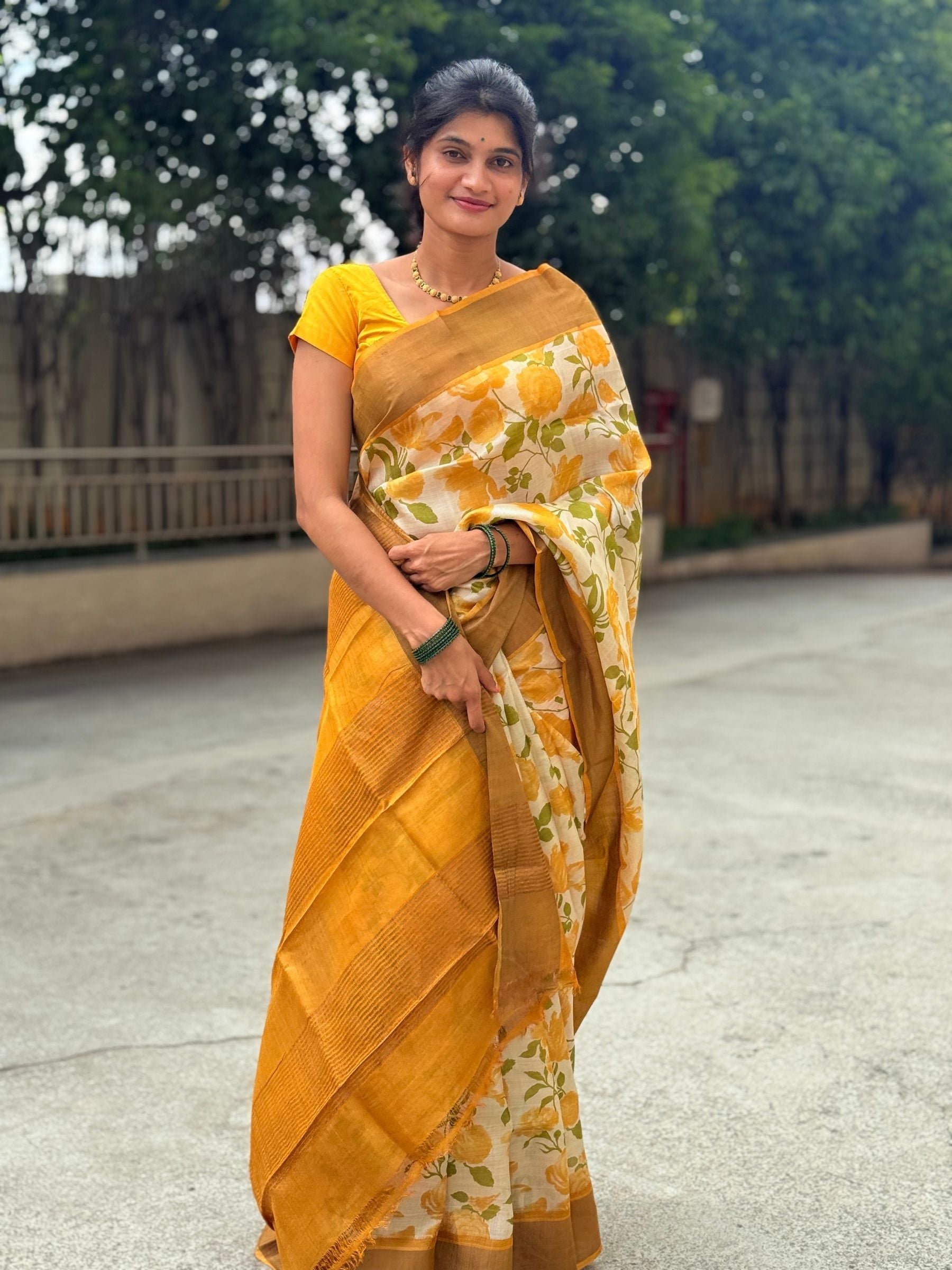Yellow handloom tussar silk saree with floral prints