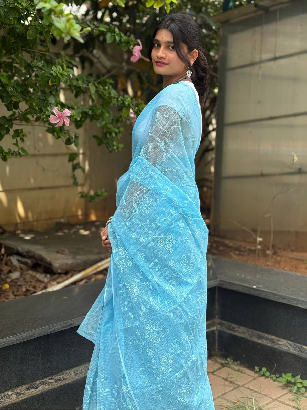 Light blue Kota Doria saree with delicate floral embroidery