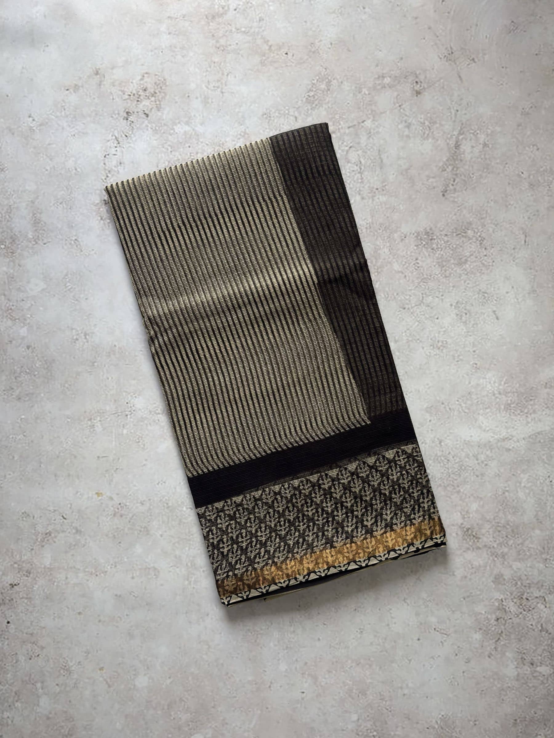Hand block printed Kota Doria saree in beige and black with traditional motifs