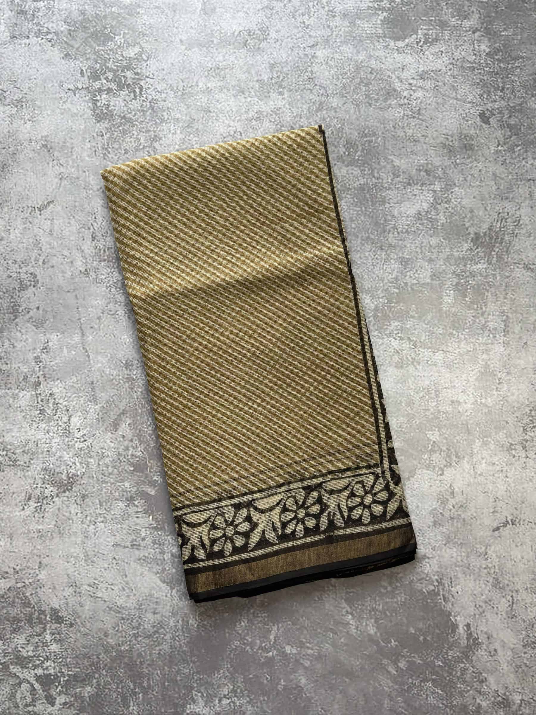 Beige hand block printed Kota Doria saree with olive floral motifs and detailed pallu