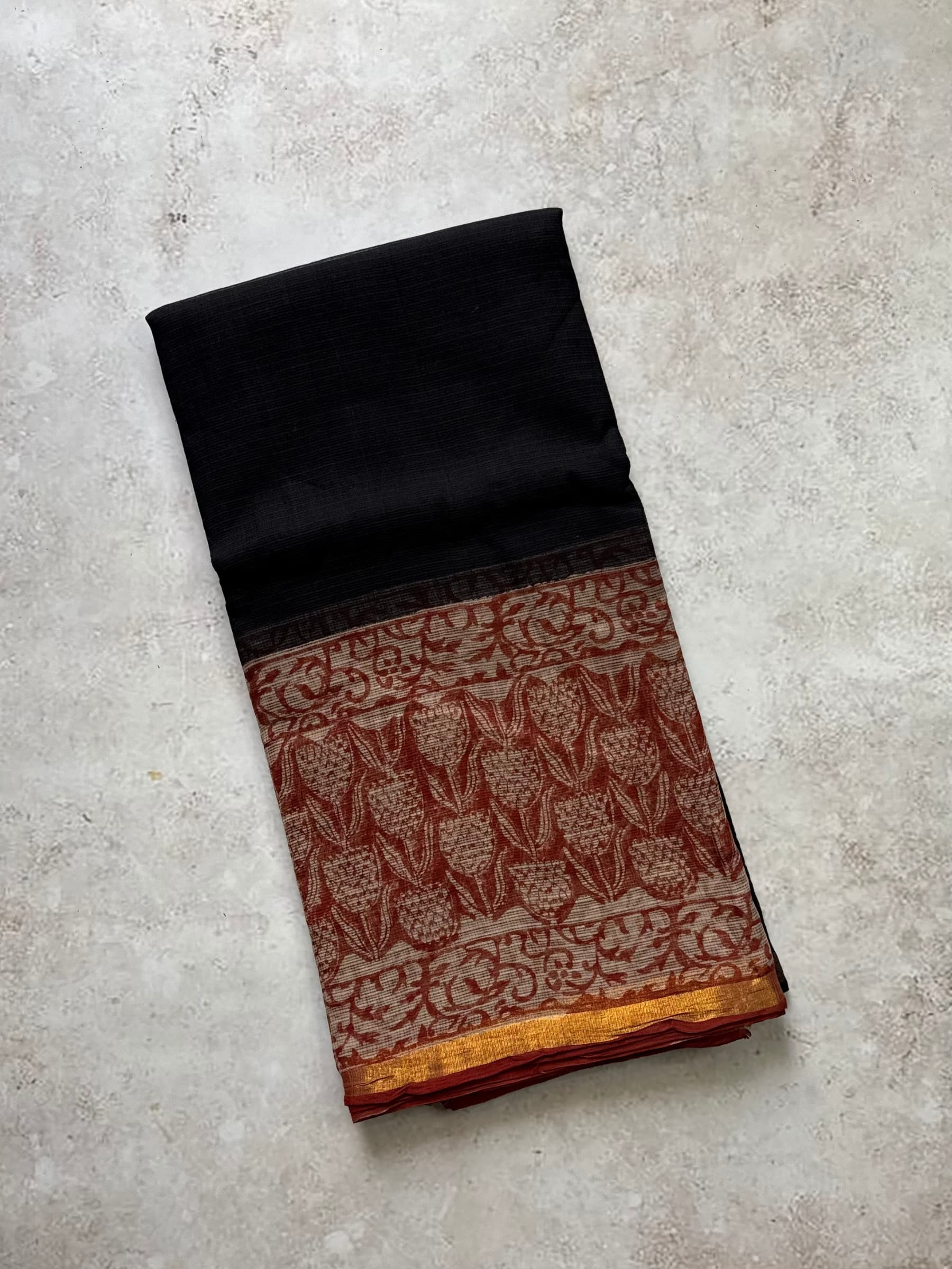 Black Kota Doria saree with rust hand block printed pallu