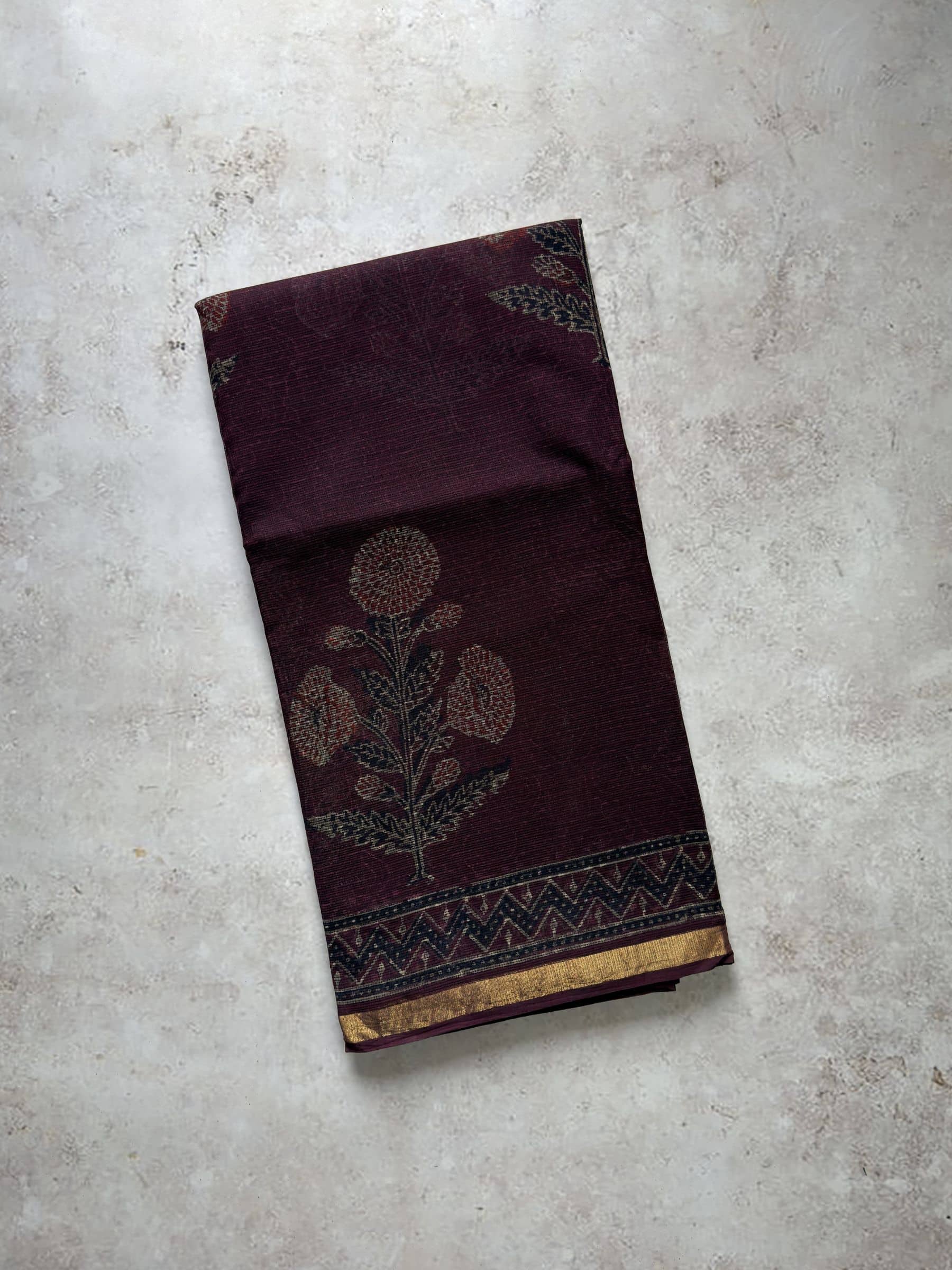 Deep plum hand block printed Kota Doria saree with floral motifs and traditional pallu