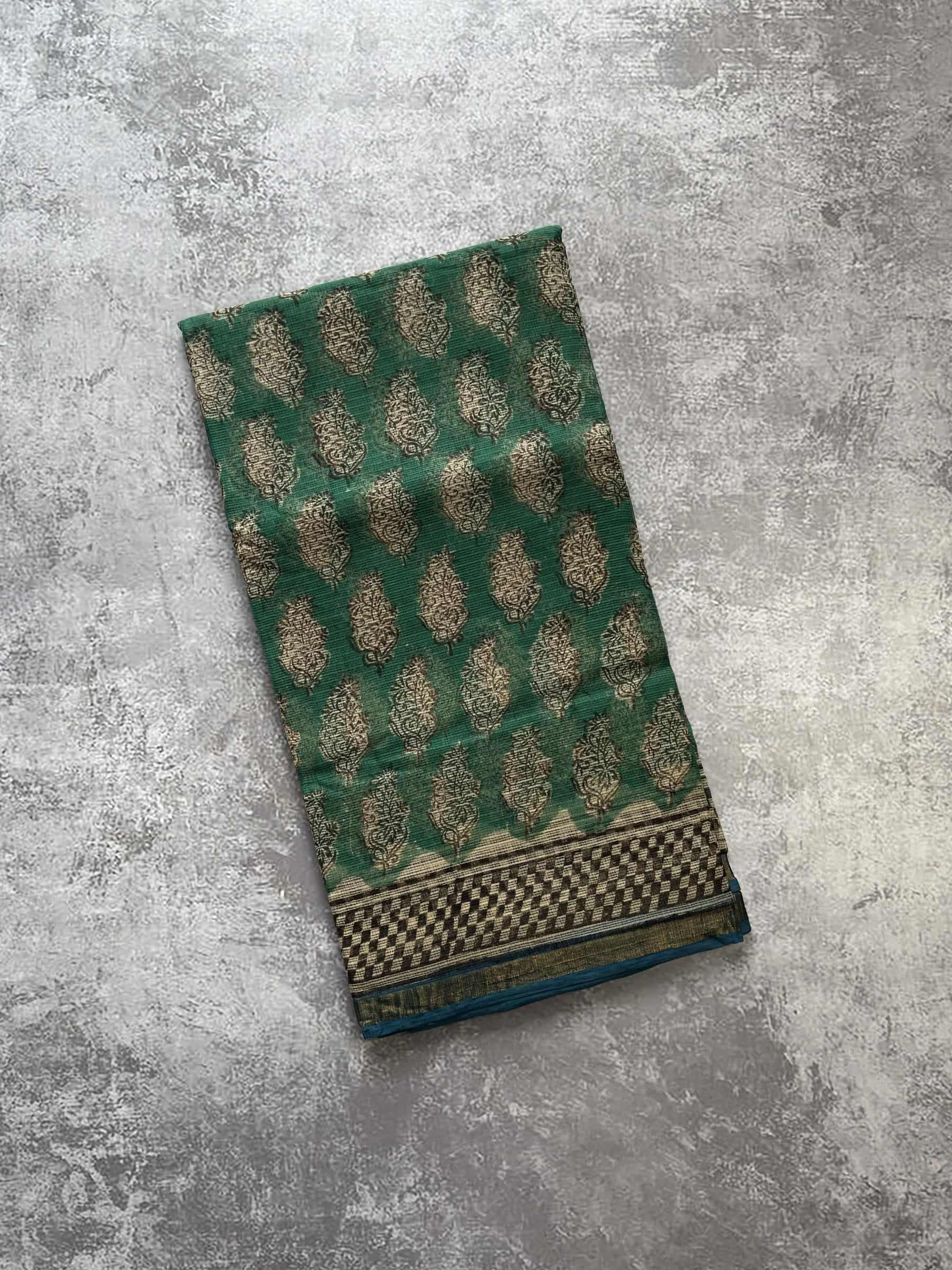 Emerald green hand block printed Kota Doria saree with floral motifs and detailed pallu