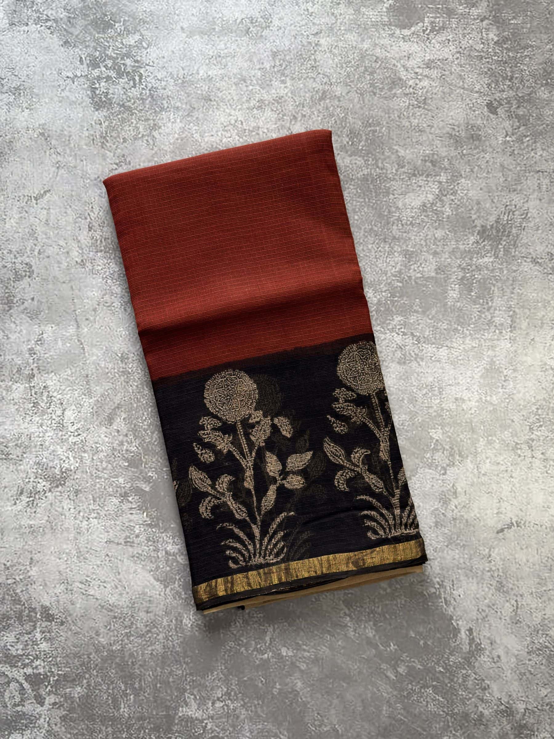 Red hand block printed Kota Doria saree with black floral pallu