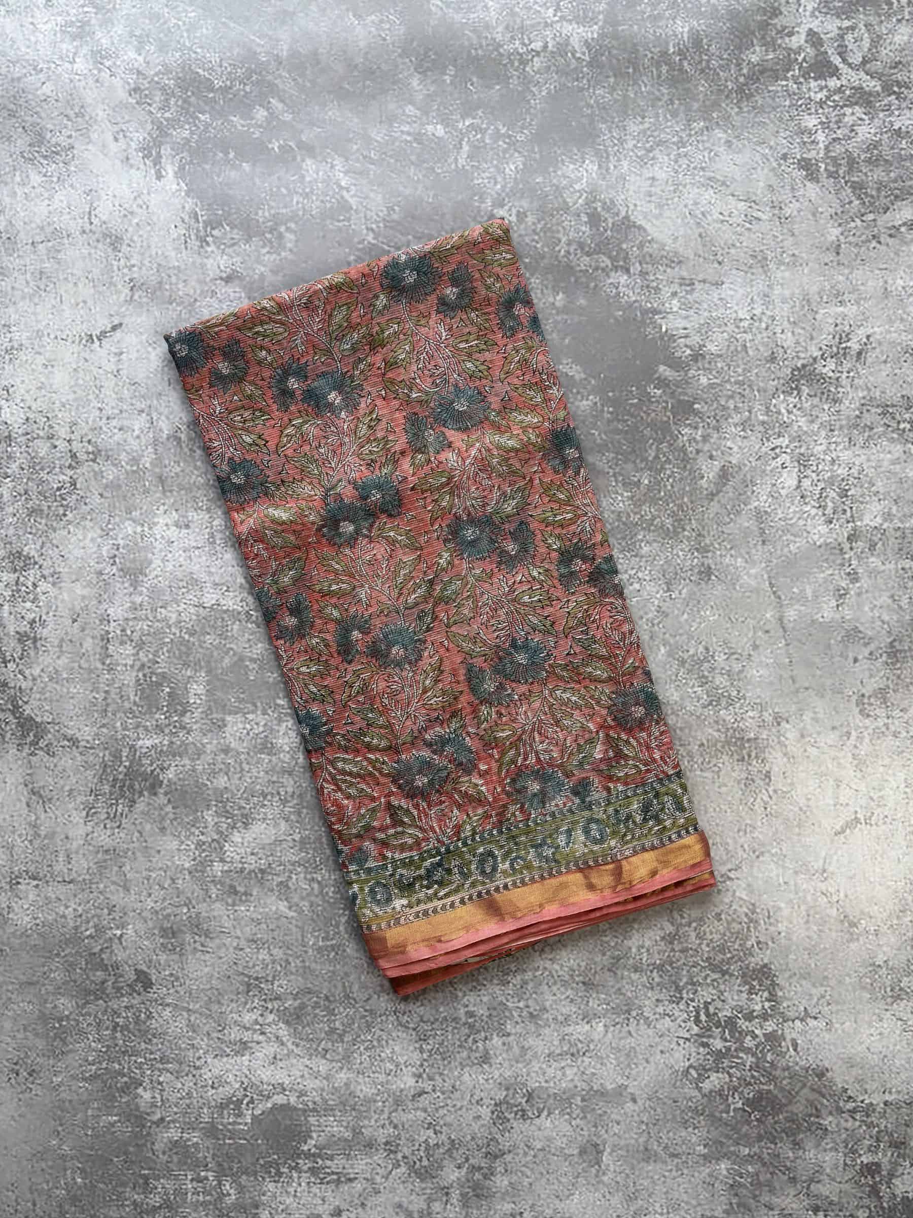Hand block printed Sanganeri Kota Doria saree in coral pink with floral jaal pattern