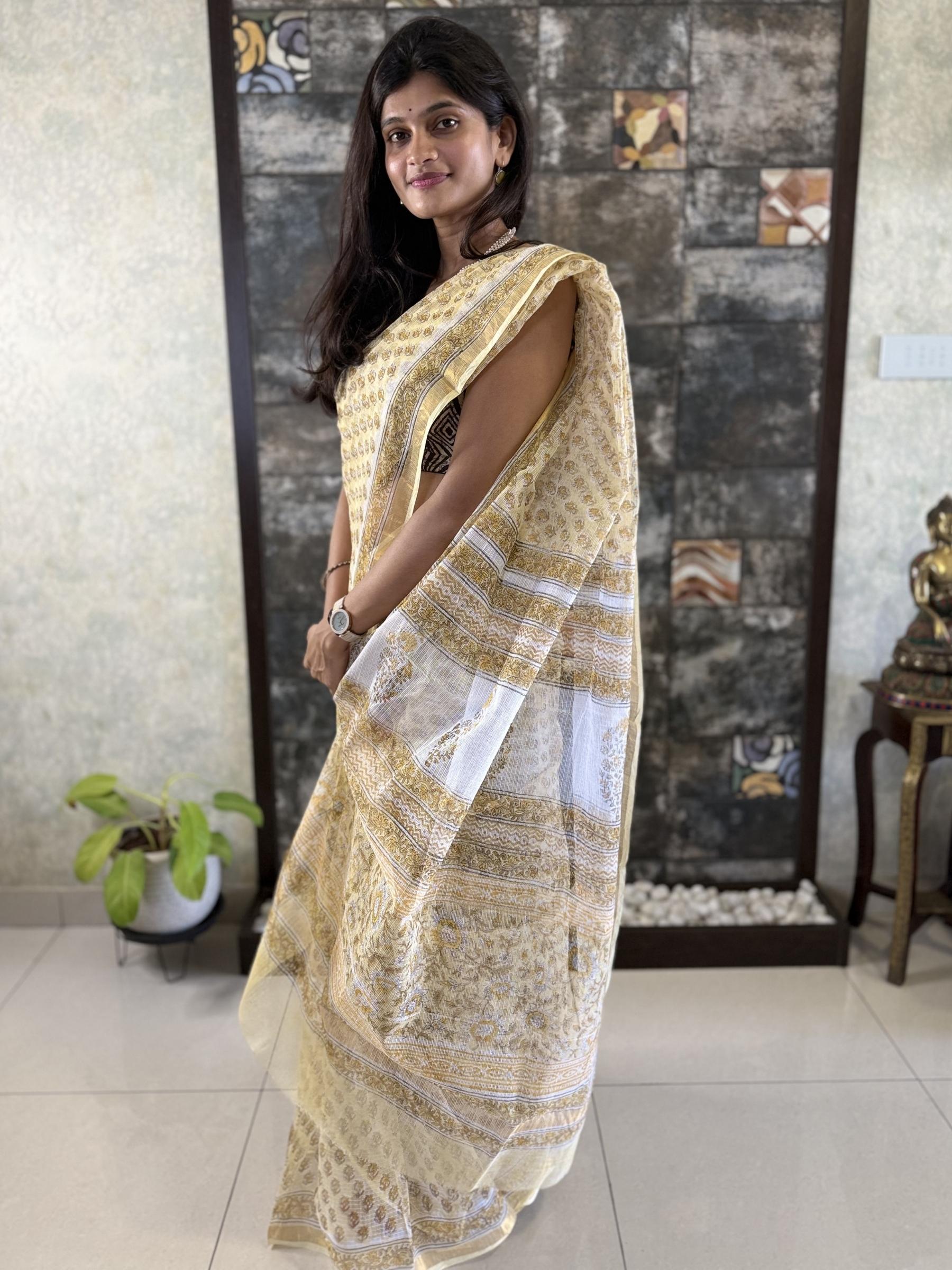 Yellow Kota Doria saree with floral block prints